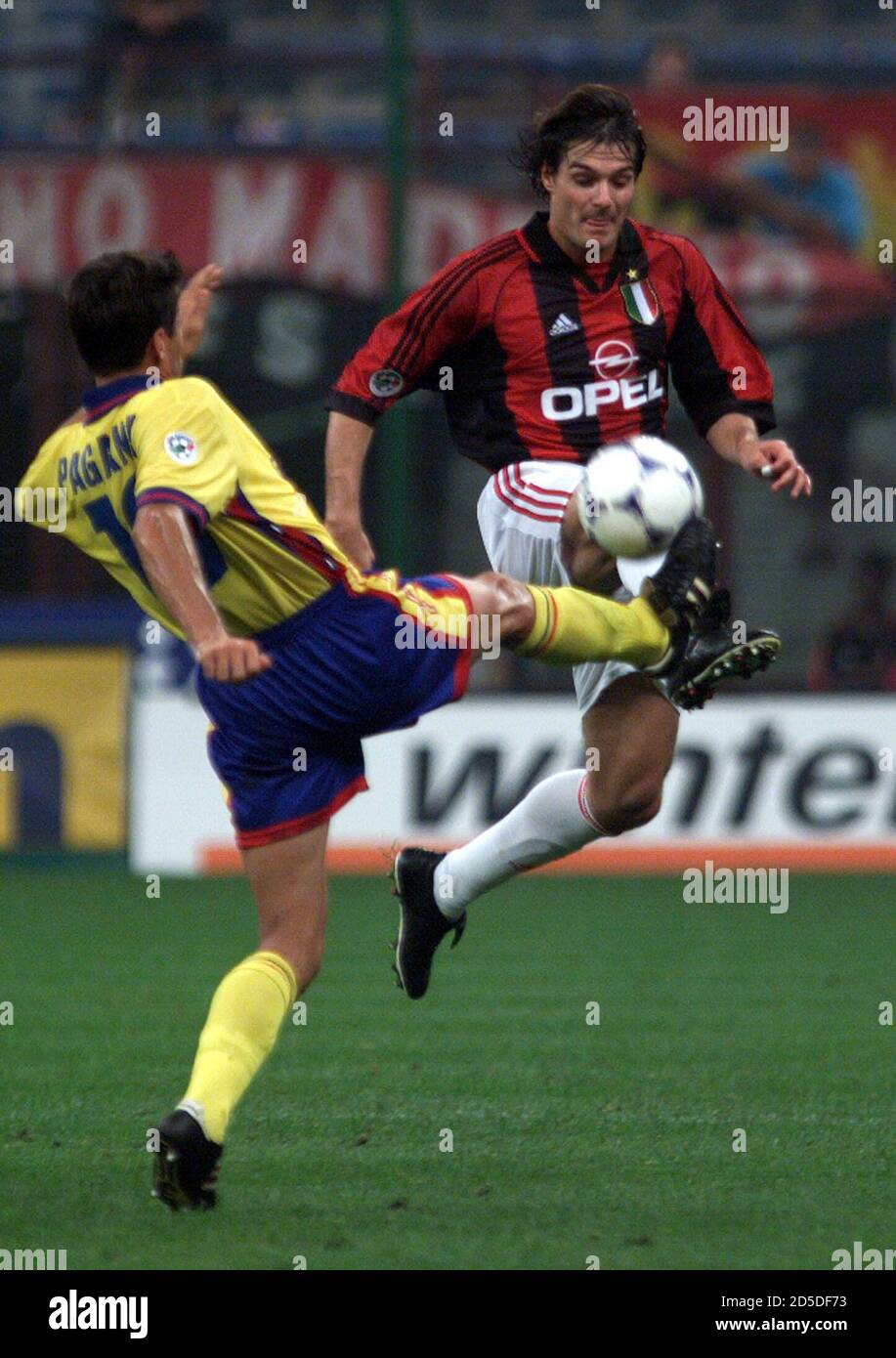 Milan Midfielder Guglielminpietro R Fights For The Ball With Bologna Defender Massimo Paganin During Their Italian Serie A Soccer Match At Meazza Stadium In Milan September 25 Sr Me Stock Photo Alamy