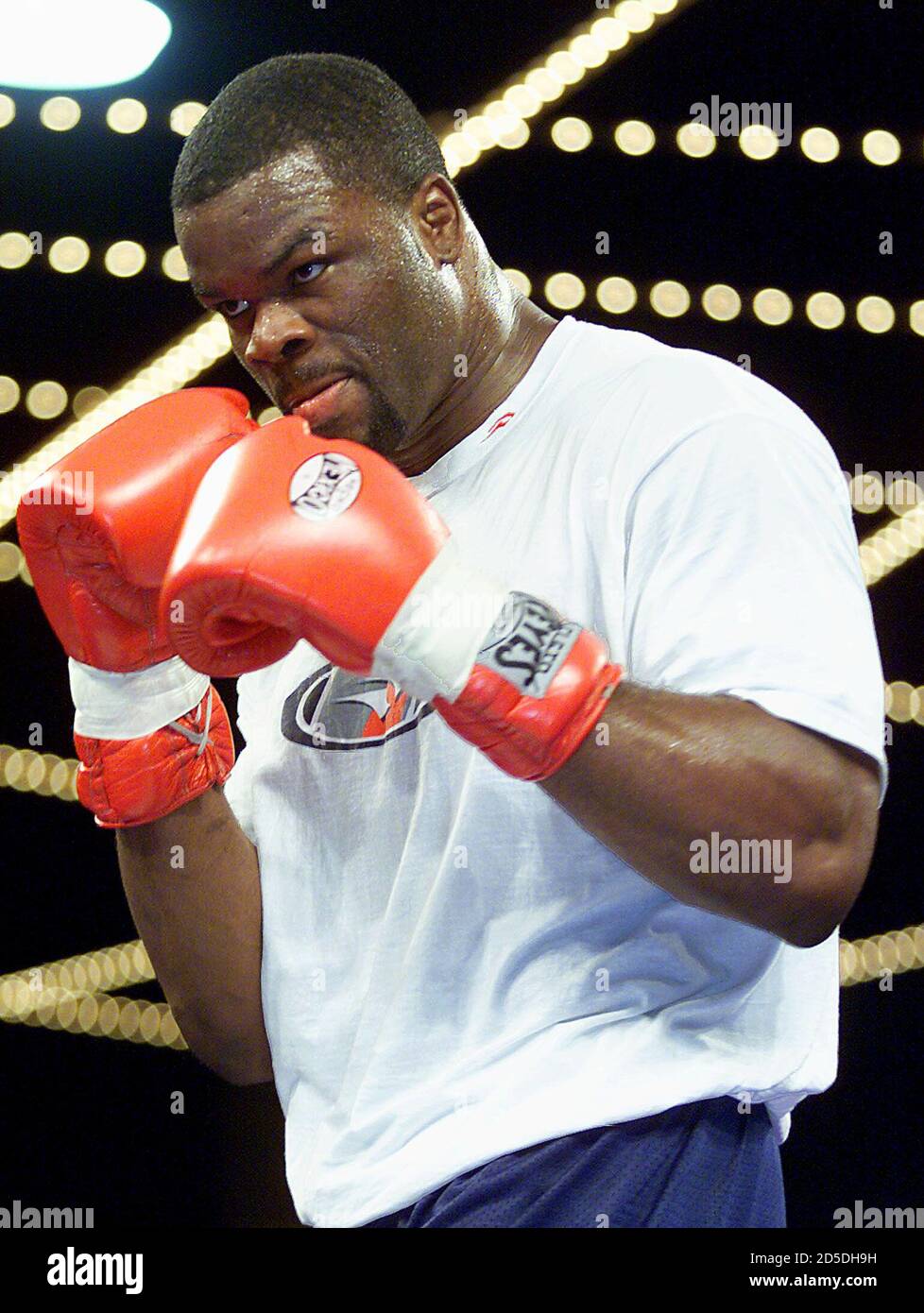 American heavyweight boxer Michael Grant shadow boxes during a workout at  New York's Madison Square Garden April 25. [Grant was preparing for his  upcoming fight against world heavyweight champion Lennox Lewis from