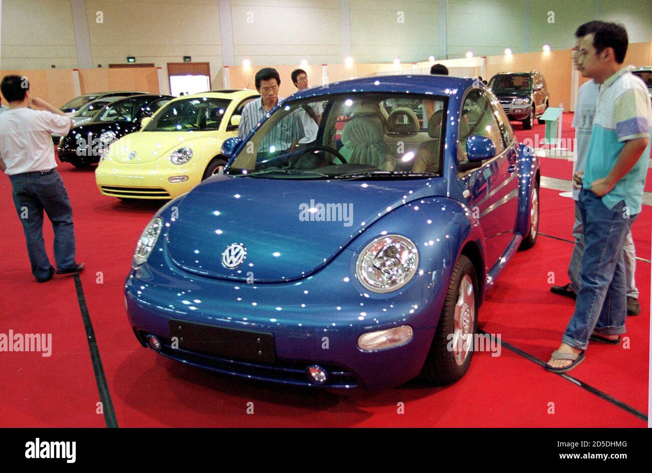 Indonesians Look At A Volkswagon Beetle Which Carries A Pricetag Of 380 Million Rupiah Us 44 000 At A Car Exhibition In Jakarta June 8 Prices Of Imported Cars Have Increased 4 Percent Since<script async src=