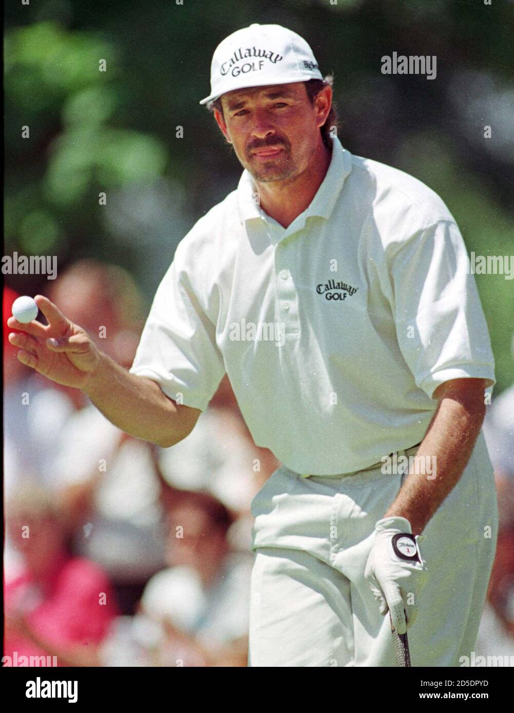 Carlos Franco of Asuncion, Paraguay holes lifts his golf ball after a  birdie putt on the 6th hole that tied him for the lead at Brown Deer Park  Golf Course in Brown