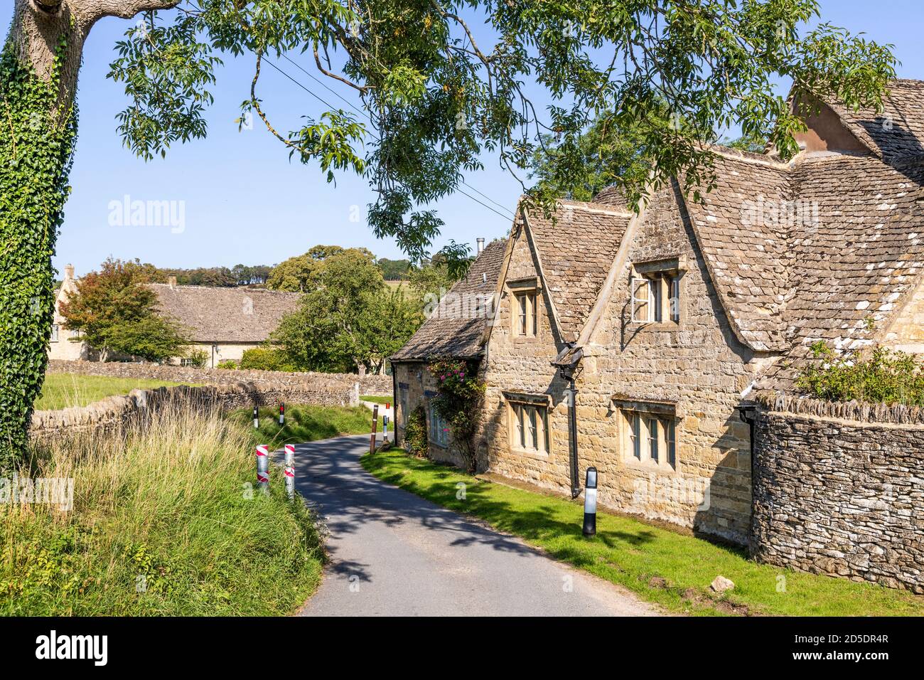 Old stone cottages at Barton near the Cotswold village of Guiting Power, Gloucestershire UK Stock Photo