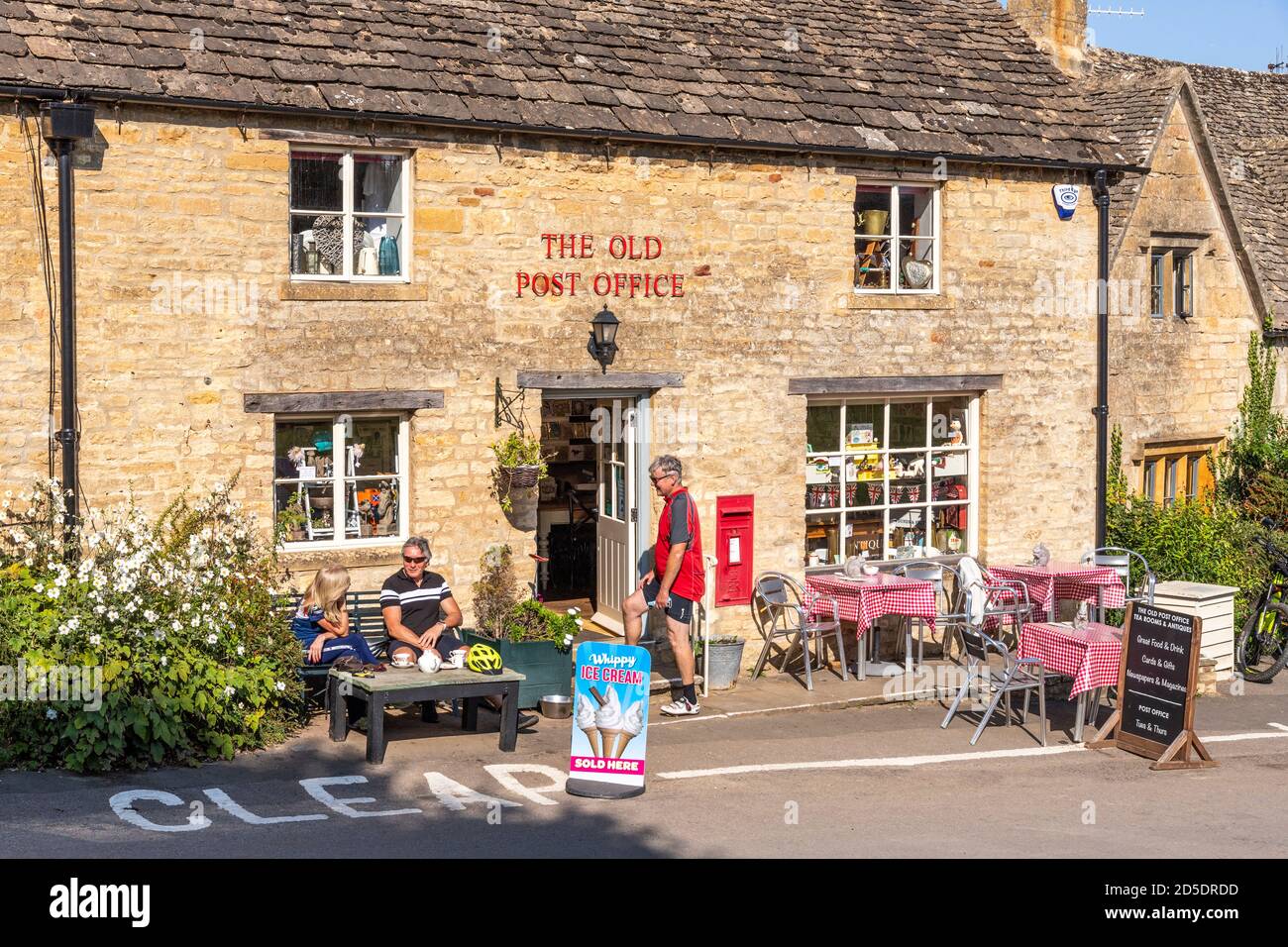 Alfresco tea break outside the Old Post Office in the Cotswold village of Guiting Power, Gloucestershire UK Stock Photo