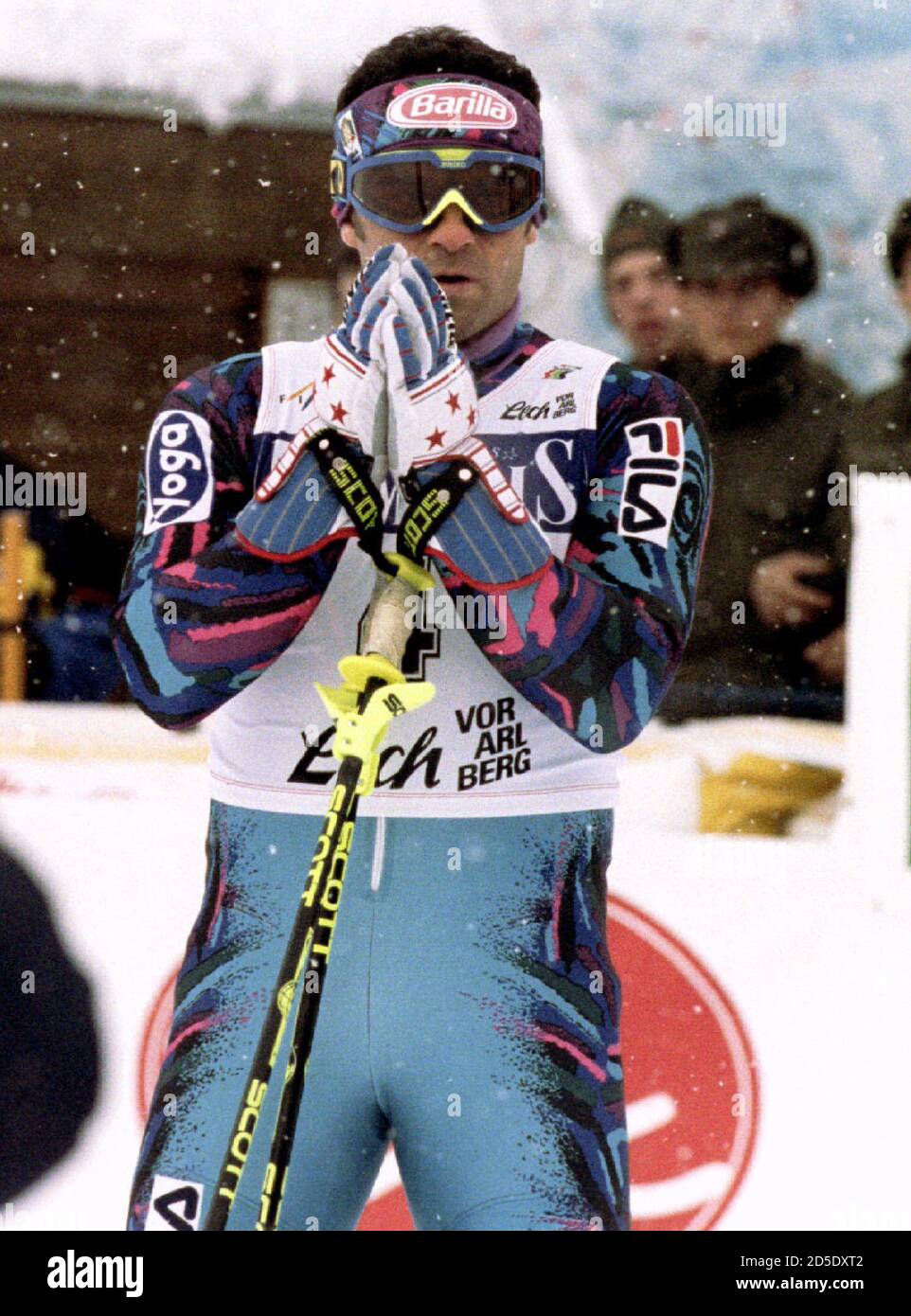 Italy's Alberto Tomba folds his hands as he reacts after crossing the  finnish line to win the World Cup Slalom December 21 Stock Photo - Alamy