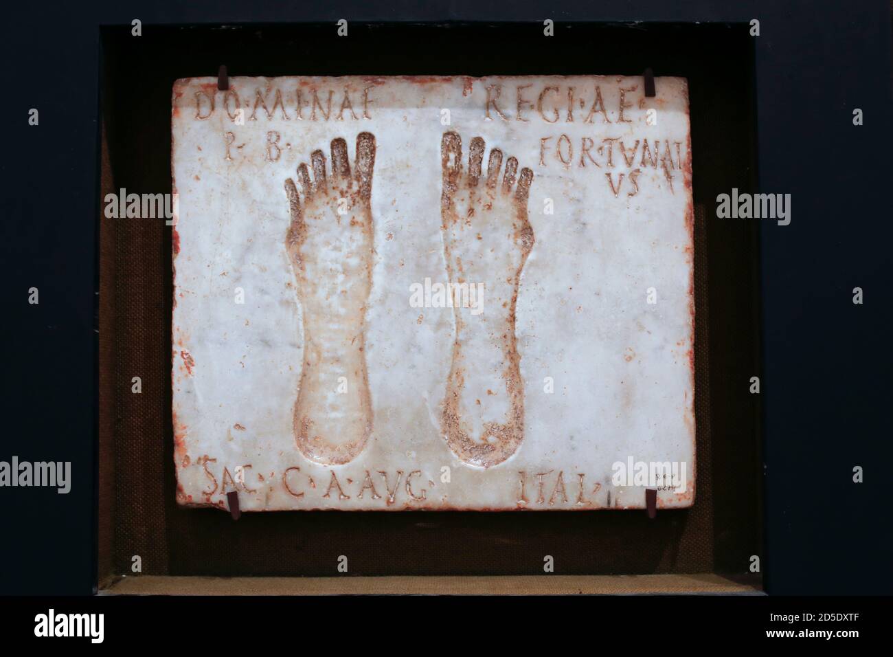 Seville, Spain - July 7th, 2018: Feet carved-into-marble. Votive offering to Nemesis, patroness of gladiators. Archaeological Museum of Seville, Andal Stock Photo