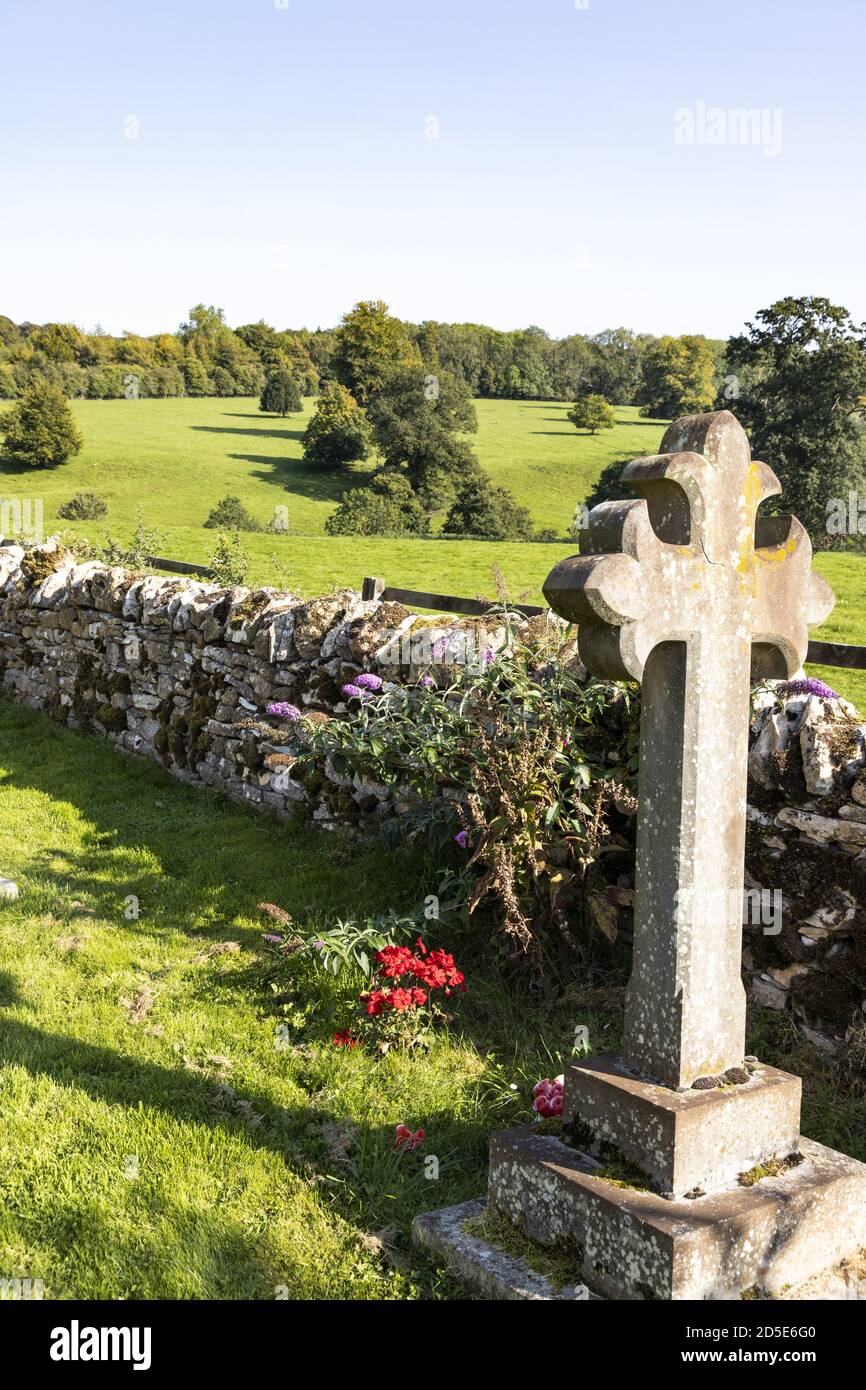 The view of the countryside from the churchyard of St Mary's church in the Cotswold village of Temple Guiting, Gloucestershire UK Stock Photo