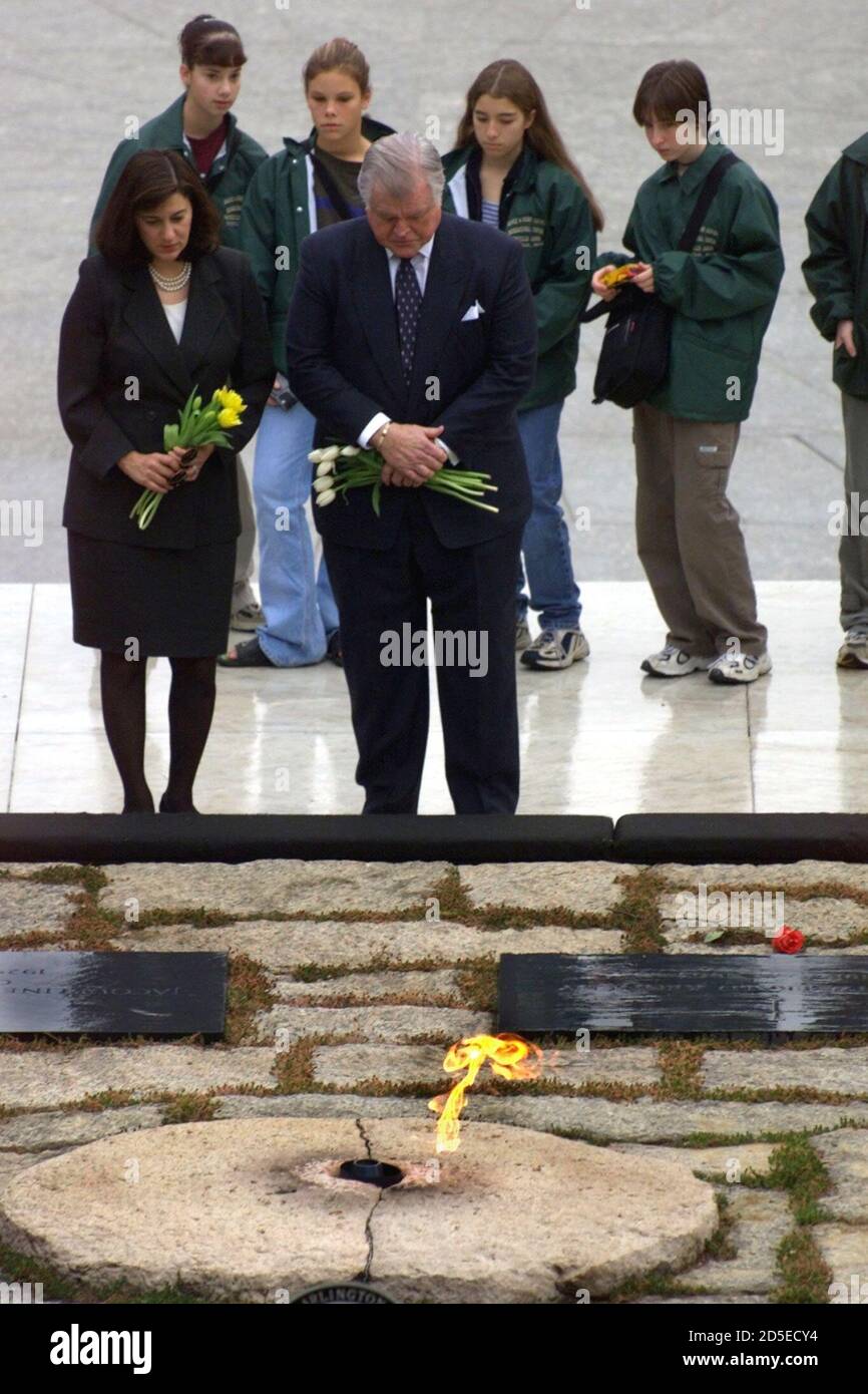 Senator Edward Kennedy and his wife Victoria pause at the gravesite of President John F. Kennedy and Jackie Kennedy, November 22 on the 36th anniversary of JFK's assassination. The President was shot to death in Dallas on November 22, 1963. Stock Photo