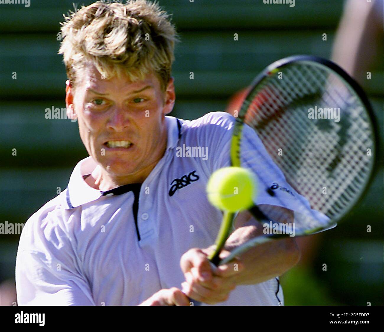 Sweden's Thomas Enqvist returns the ball a[gainst Nicolas Keifer of  Germany] at the Colonial Classic tennis tournament in Melbourne January 12.  Enqvist won 6-3, 6-4. [The four-day tournament has attracted eight of
