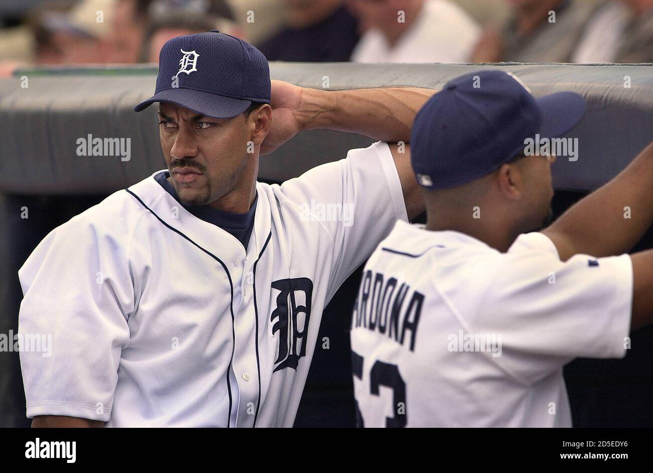 Detroit Tigers' newly acquired power hitter Juan Gonzalez (L) of Vega Baja,  Puerto Rico, looks to the field during their spring training game with the  Pittsburgh Pirates at Marchant Stadium in Lakeland,