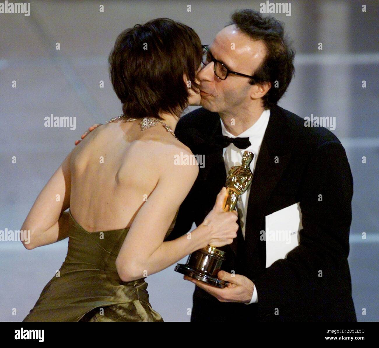 Hillary Swank receives a kiss from presenter Roberto Benigni after winning  the Oscar for Best Actress at the 72nd Annual Academy Awards, March 26.  Swank won for her roll in "Boys Don't