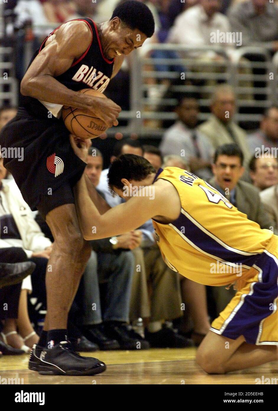 Portland Trail Blazers' Scottie Pippen (L) is pushed out of bounds by Los  Angeles Lakers' Travis Knight during Game 2 of the NBA Western Conference  finals in Los Angeles May 22. LC/SV
