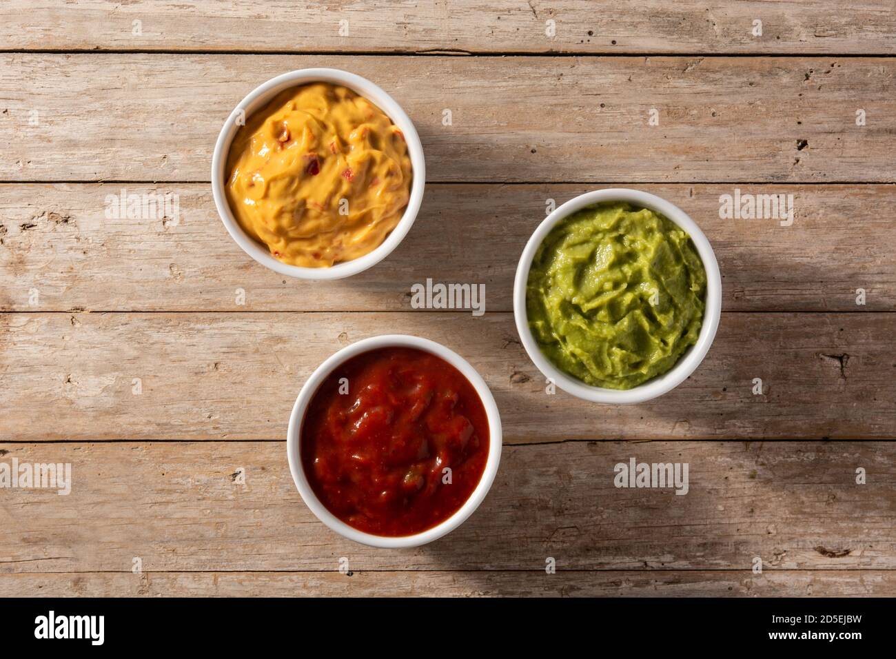 Traditional Mexican sauces. Guacamole, chilli pepper sauce and cheese