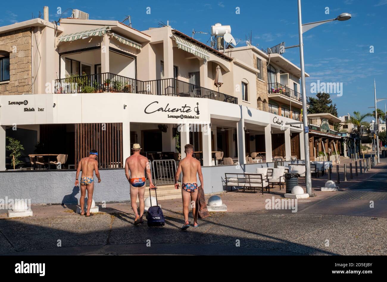 Paphos, Cyprus. 13th Oct 2020. Three British tourists on Bar Street in the deserted tourist area of Kato Paphos during the Coronavirus Pandemic.  Bar Street, Paphos, Cyprus. 13th October, 2020.    Credit: Ian Rutherford/Alamy Live News. Stock Photo