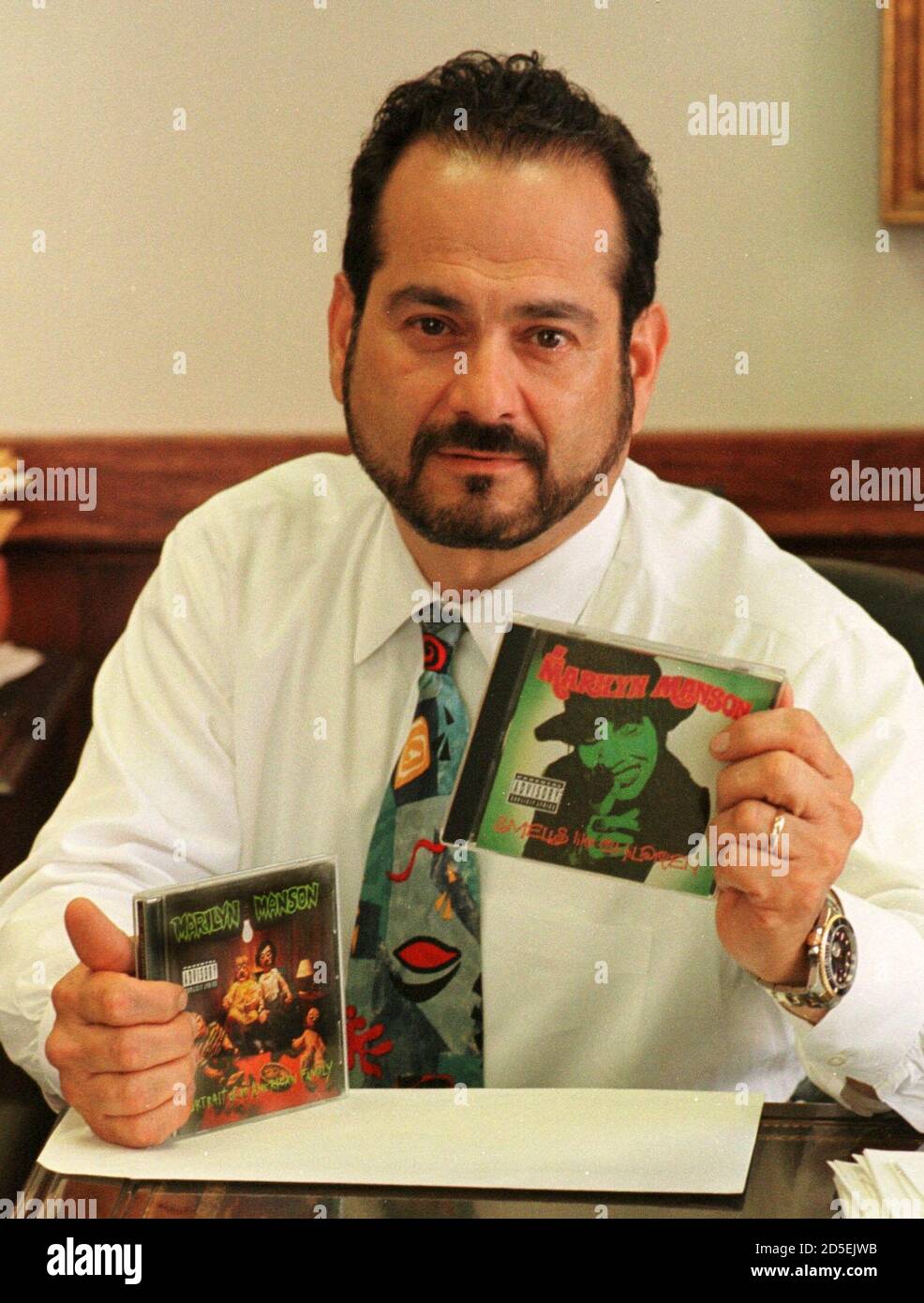 Attorney Paul J. Cambria Jr., spokesman and counsel for shock-rock musician 'Marilyn Manson' holds two recent CD's April 21 in Buffalo, NY, as he disclaims any connection between the singer and the high school shootings in Littleton, CO. The shooting suspects reportedly talked about the music of 'Marilyn Manson', a stage name for singer Brian Warner derived from Marilyn Monroe and Charles Manson.  JT/RC Stock Photo