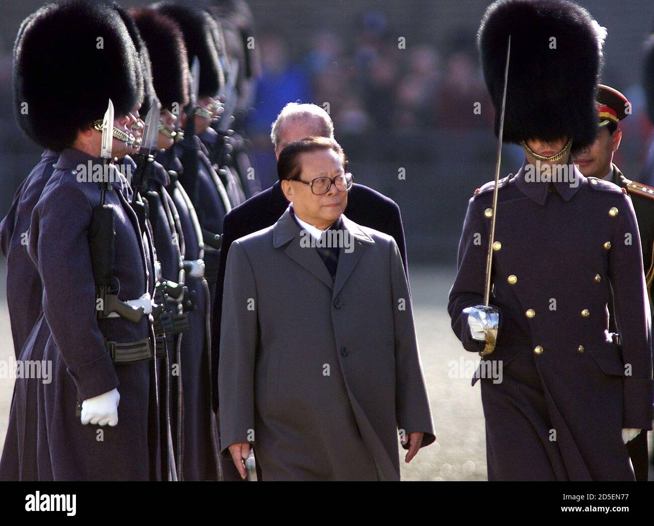 China's President Jiang Zemin is escorted by Prince Philip (obscured) as he inspects a guard of honour at the start of his state visit to Britain, October 19. Protestors including Tibetan independence activists and human rights campaigners have threatened to dog Jiang's visit, the first by a Chinese head of state.  PH/HP/NS Stock Photo
