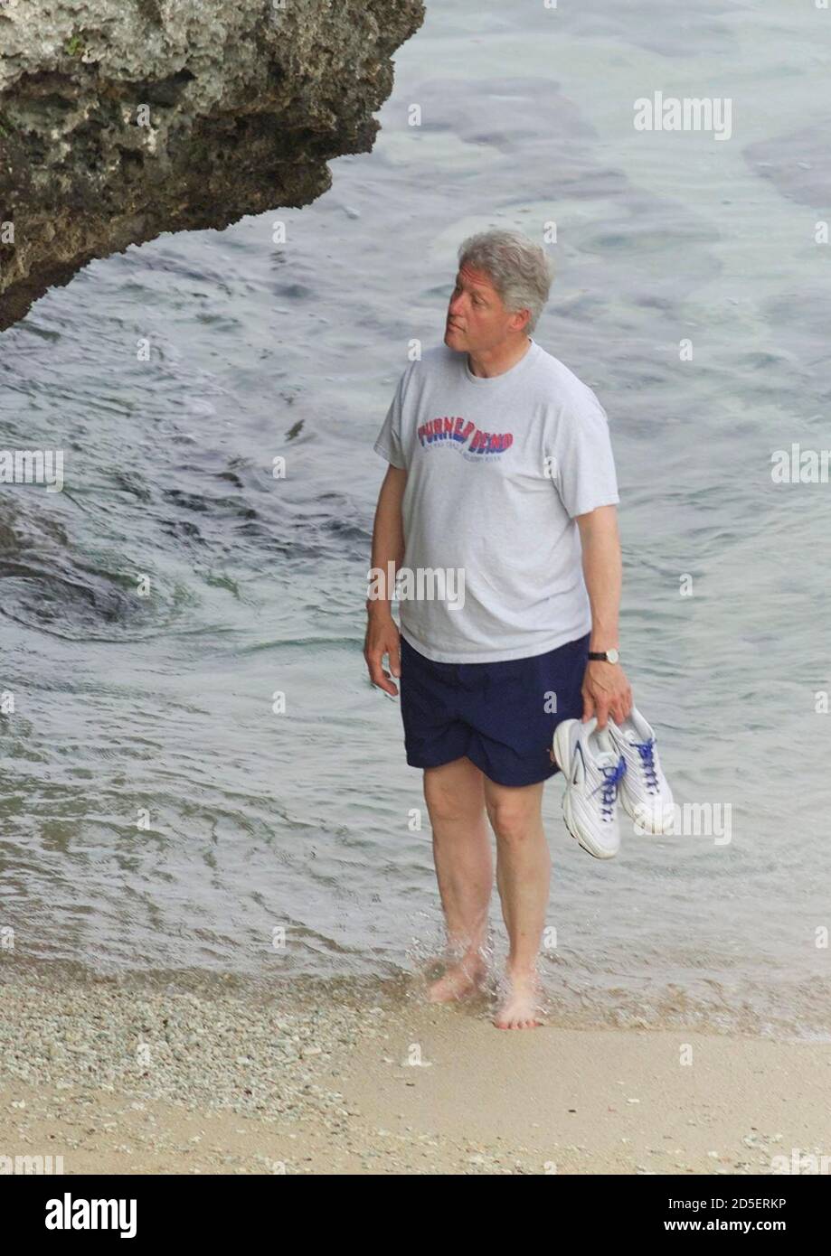 United States President Bill Clinton Walks On The Beach Outside His Hotel On The Japanese Island Of Okinawa July 22 Clinton Is In Japan To Attend The Group Of Eight G8 Summit