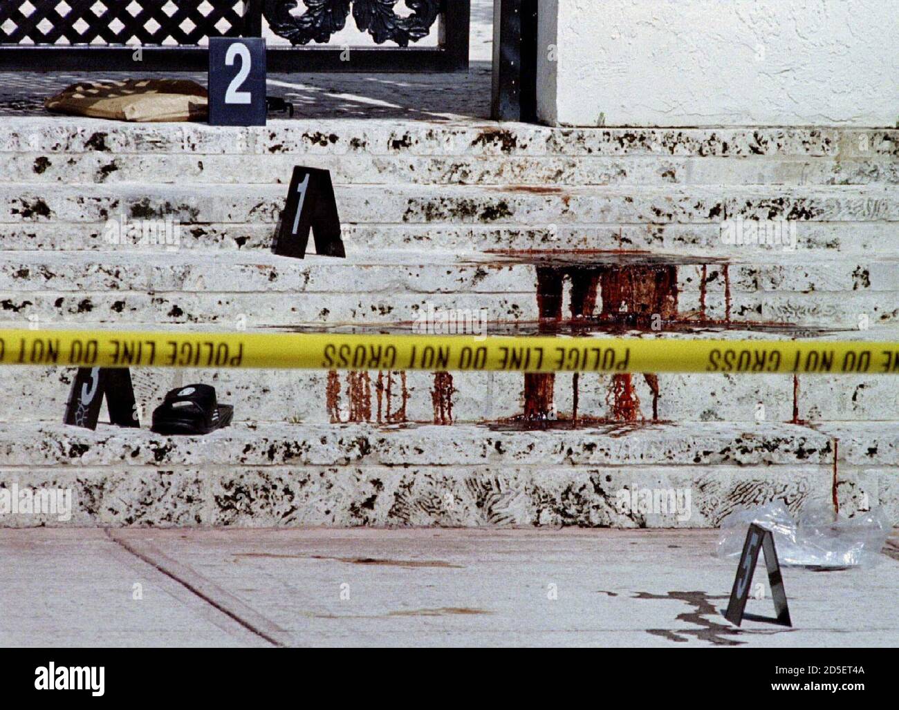 An Italian Newspaper In A Paper Bag 2 And A Slipper L Are Marked As Evidence In Front Of The Miami Beach Home Of Fashion Designer Gianni Versace 50 Who Was Murdered