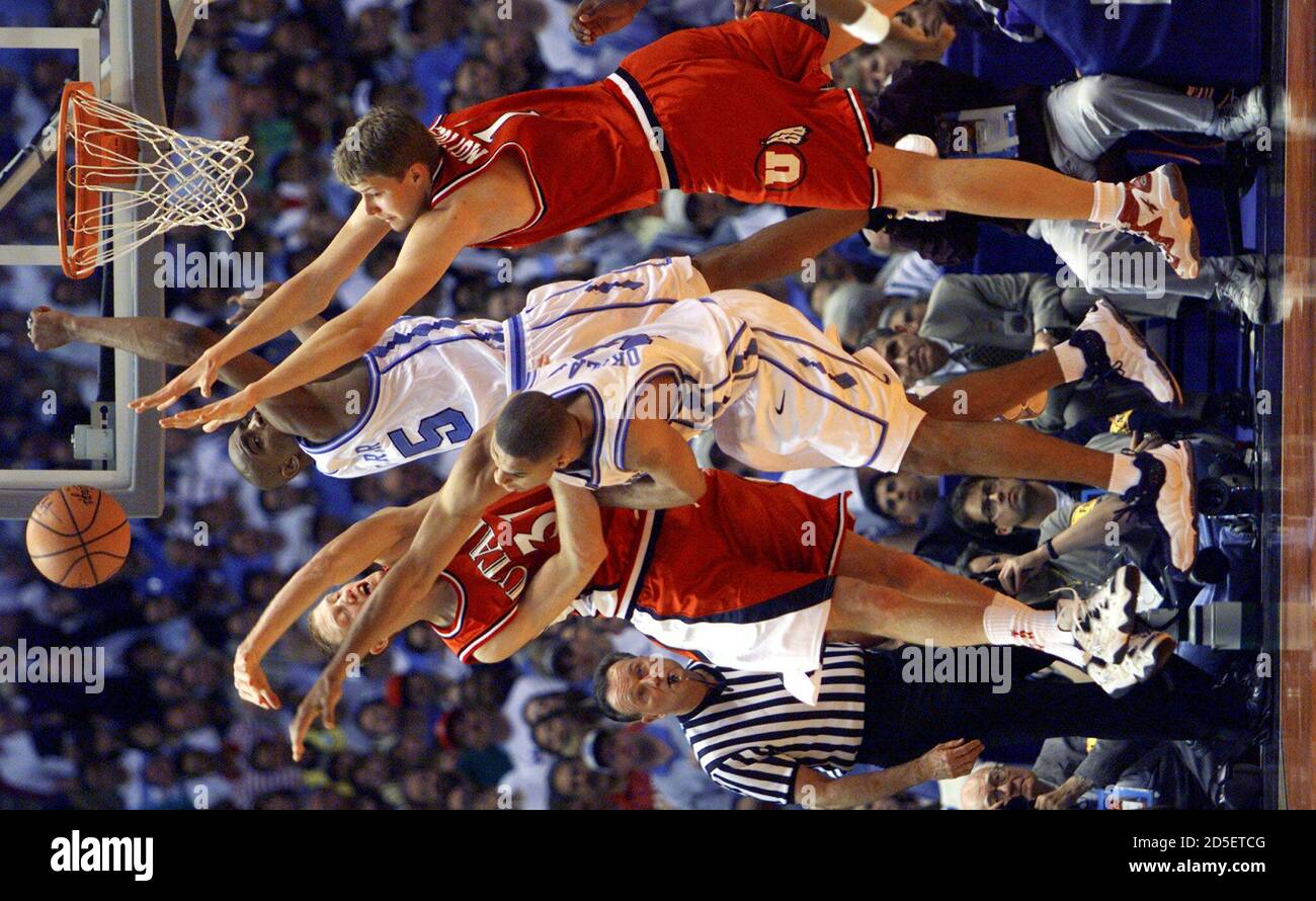 Utah Ute S Britton Johnsen L And Hanno Mottola R Go Up For The Ball With North Carolina S Vince Carte 15 And Ademola Okulaja During First Half Action In Their Ncaa Final Four Utah Ute S Britton Johnsen L And Hanno Mottola R Go Up For The Ball With North Carolina S Vince Carte 15 And Ademola Okulaja During First Half Action In Their Ncaa Final Four