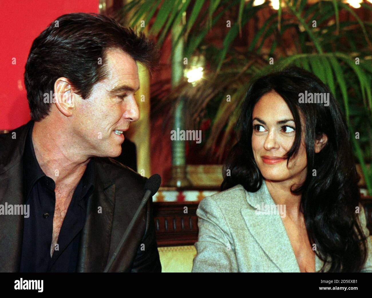 Actor Pierce Brosnan looks at Italian actress Maria Grazia Cuccinotta after arriving in Bilbao February 15. Brosnan and Cuccinotta will film in Spain some sequences for the new James Bond film "The World is not Enough", also starring Robert Carlyle, Serena Scott Thomas, Denise Richards and Sophie Marceau. ES/KM Stock Photo