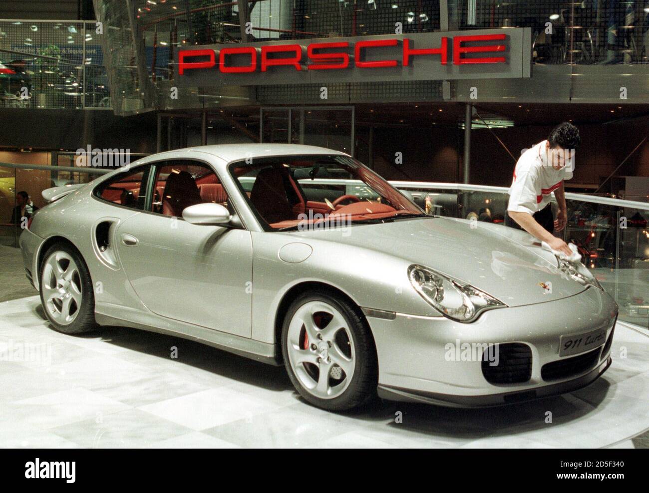 A Porsche 911 Turbo, top version of the 911 family, is polished to a high  gloss prior to the opening of the Geneva International Car Show, February  29. The Porsche 911 Turbo