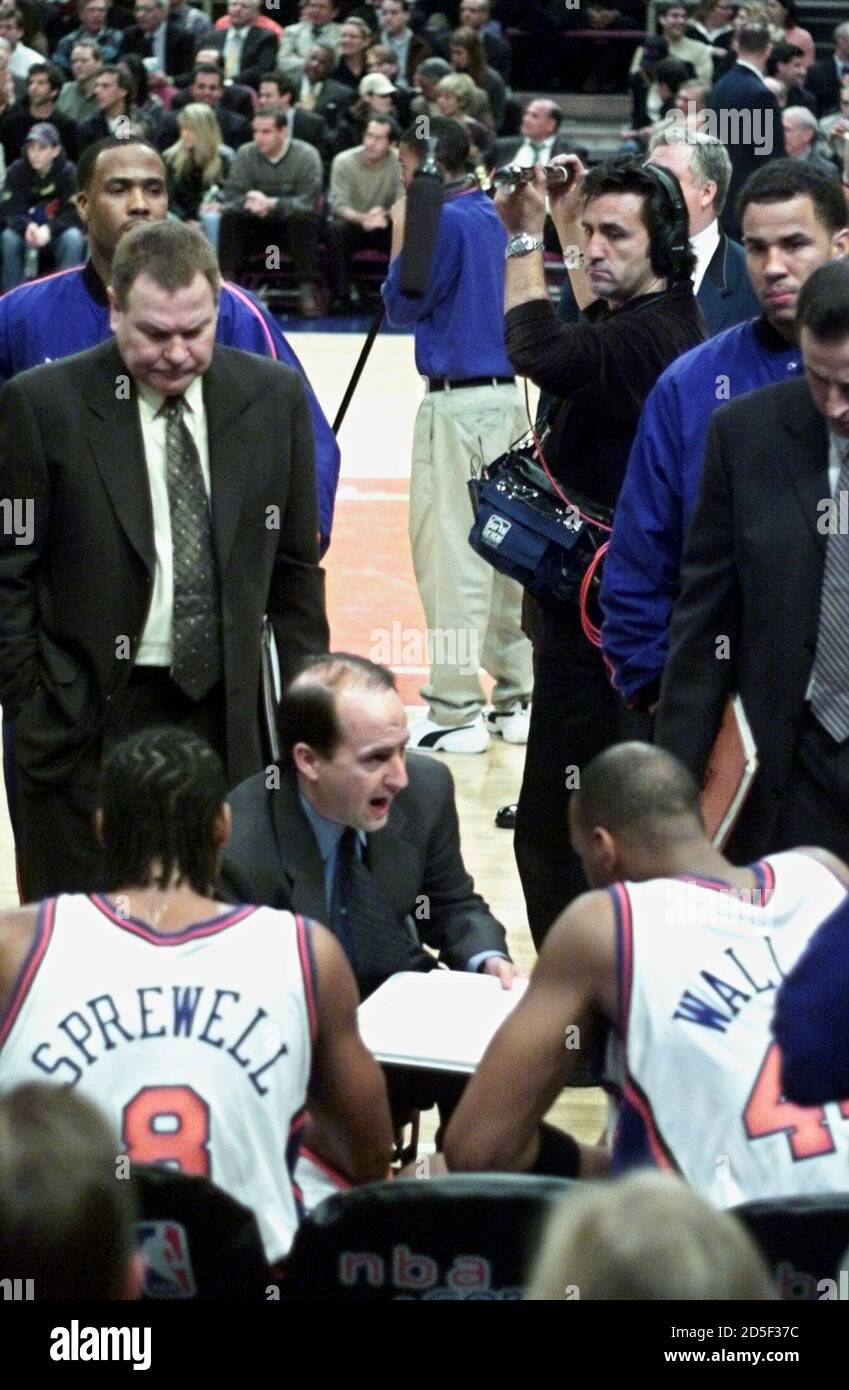 New York Knicks coach Jeff Van Gundy has his team huddle monitored by a boom  microphone during a timeout in their NBA game with the Houston Rockets  March 14 at New York's