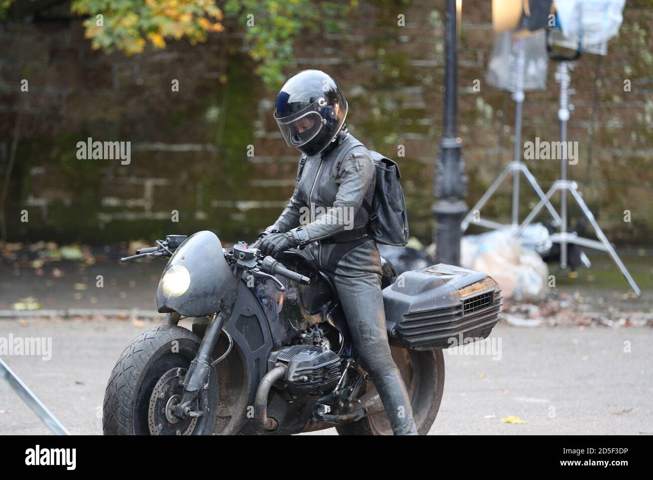 A woman on a motorbike during the filming of The Batman taking place in