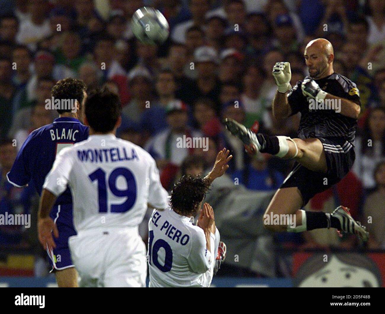 French Goal Keeper Fabien Barthez Kicks To Block The Ball Against Italy S Alessandro Del Piero And Vincenzo Montella French Goalkeeper Fabien Barthez R Kicks To Block The Ball Against Italy S Alessandro Del