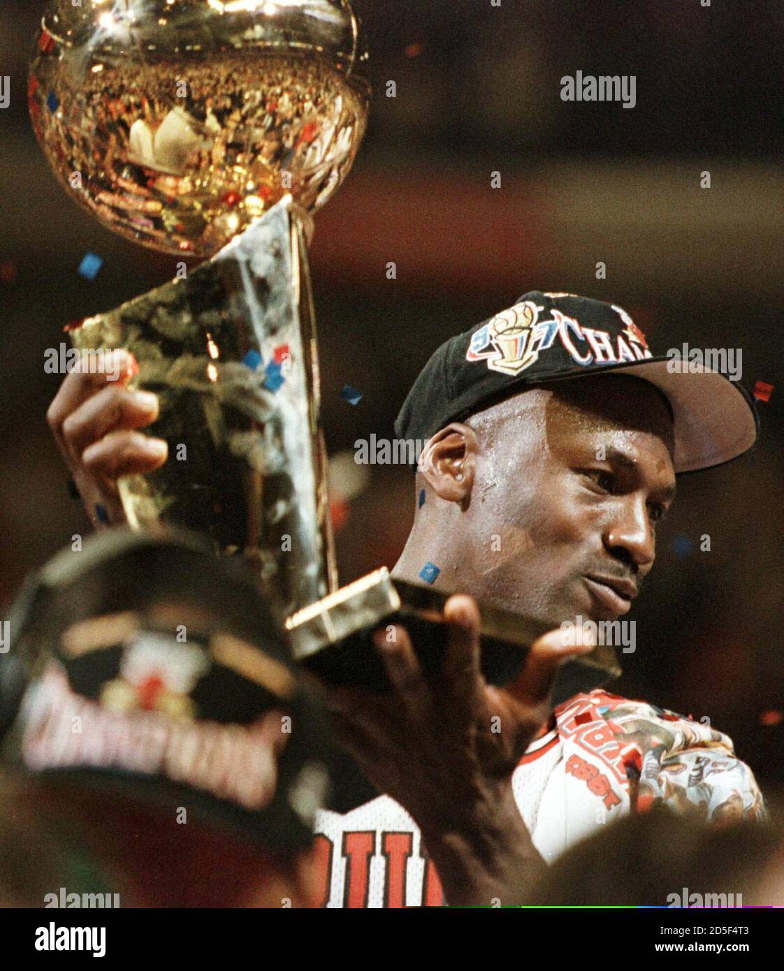 Chicago Bulls guard Michael Jordan, the series MVP, holds up the NBA  championship trophy after the Bulls defeated the Utah Jazz in game six of  the NBA Finals in Chicago, June 13,