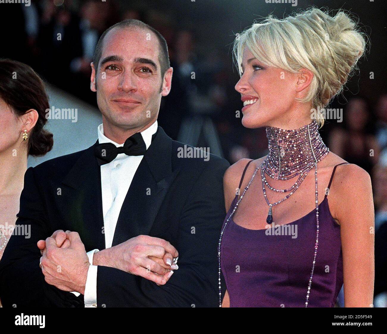 French actor Jean-Marc Barr (L) escorts French singer Ophelie Winter (R)  upon arrival for the screening of British director John Boorman's film "The  General" May 19. Boorman's entry is one of 22