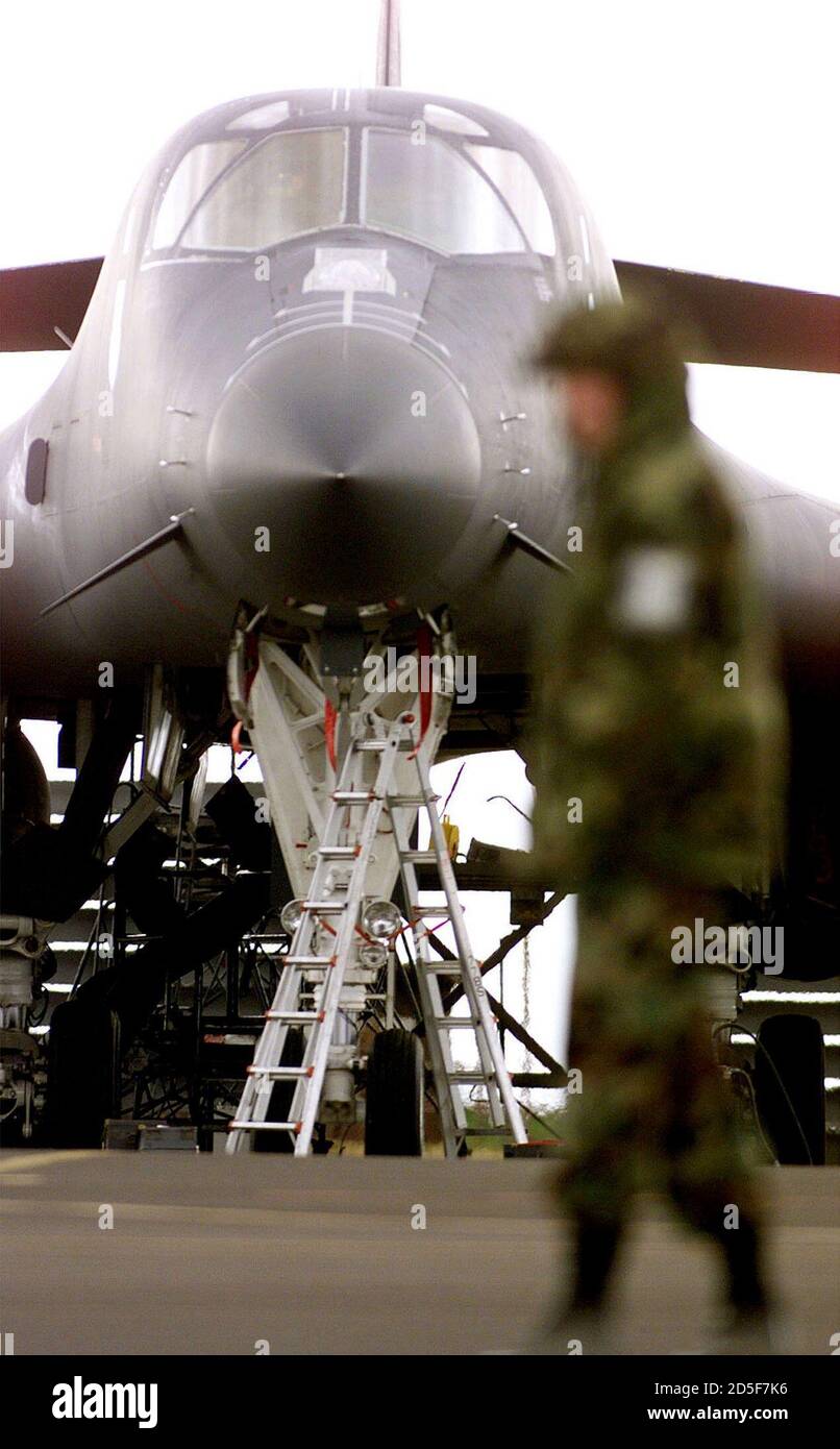 A member of the 77th Bomb Squadron of the US Air force looks at a B-1B bomber at RAF Fairford April 7. B-1B bombers have been active in Yugoslavia since their arrival in England from Ellsworth Air Force Base in South Dakota, USA last week.  PH/PS Stock Photo