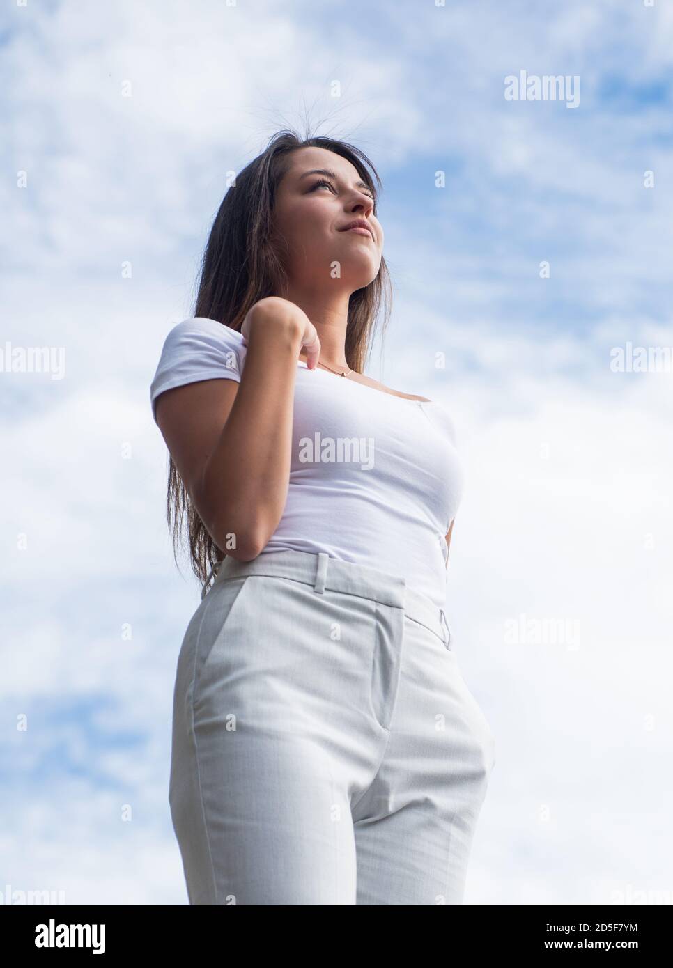 She is really cute. female urban casual fashion. happy carefree lady in  spring. beauty and fashion. fashionable woman wear stylish clothes.  confident and beautiful girl with long hair outdoor Stock Photo 