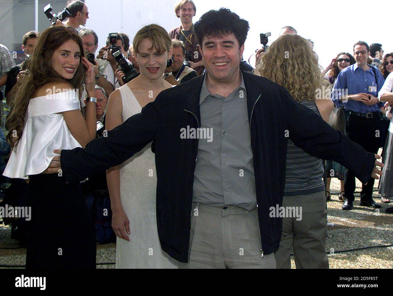 Spanish director Pedro Almodovar (C) gestures as he poses with his actresses  Antonia San Juan (2nd L) and Penelope Cruz (L) during a photocall for their film 'Todo Sobre Mi Madre'  May 15. The film will be screened in competition  at the 52nd Cannes Film Festival.         ??» Stock Photo