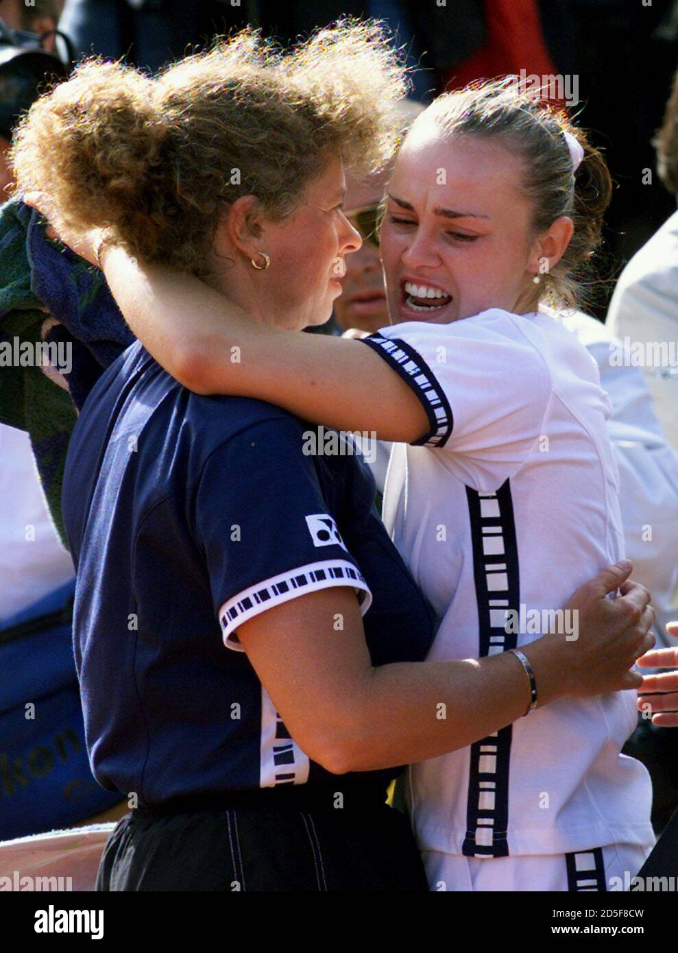 Martina Hingis (R) of Switzerland is consoled by her mother Melanie Molitor  after she was defeated by Steffi Graf of Germany in the Roland Garros  French tennis Open Women's final June 5.