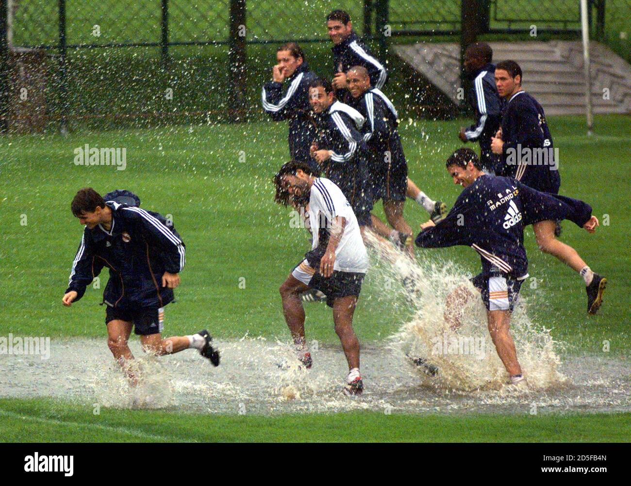Soccer Players Of The Spanish Team Real Madrid Jokes With Each Other In A Water Puddle During A Training Session In Sao Paulo January 8 Real Madrid Drew 2 2 With Brazilian Team