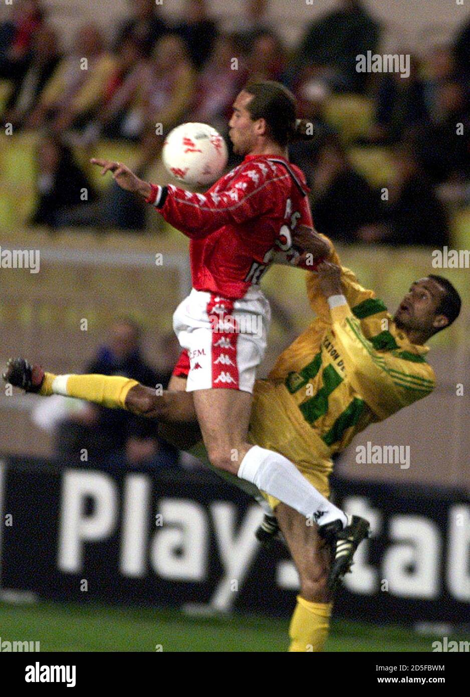 Dado Prso of Monaco (L) fights for the control of the ball with Nantes  defender Pascal Delhommeau during the French league soccer match between  Monaco and Nantes in Monaco March 26. EG//ME