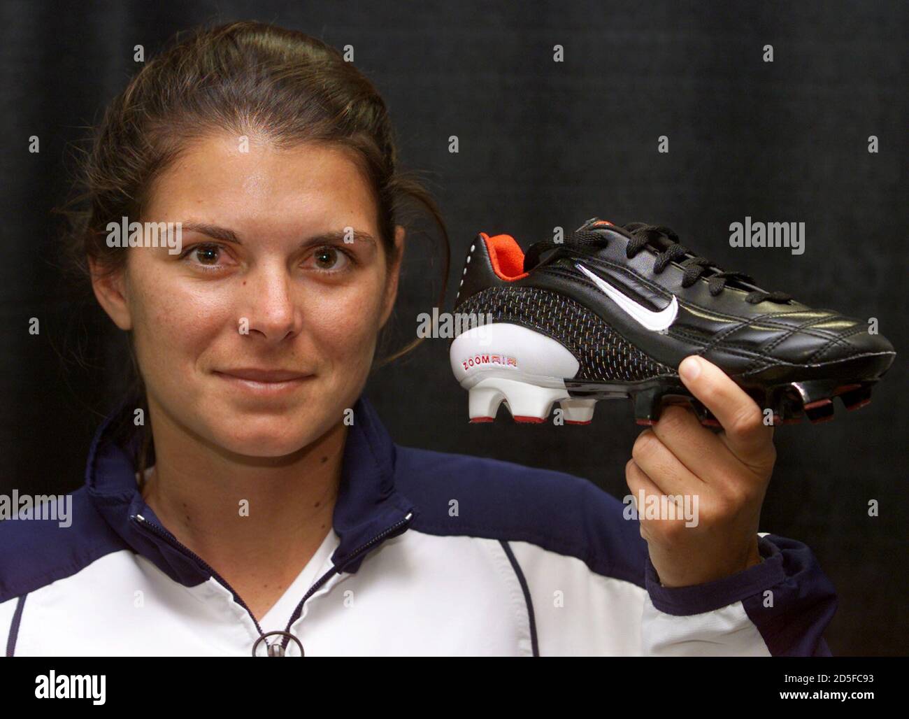 United States womens' soccer star Mia Hamm shows off her new shoe during  its unveiling in the Mia Hamm building at Nike's World headquarters in  Beaverton, Oregon, May 4. The shoe, called