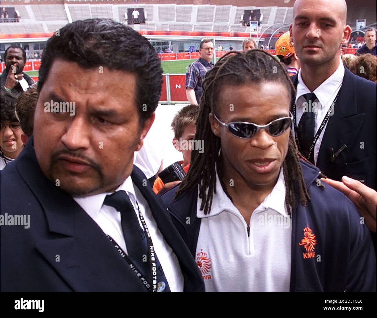 Dutch soccer player Edgar Davids (C) walks around the Olympic Stadium  surrounded by security guards during the opening of Nike Park in Amsterdam  June 10. Nike park is a place where young