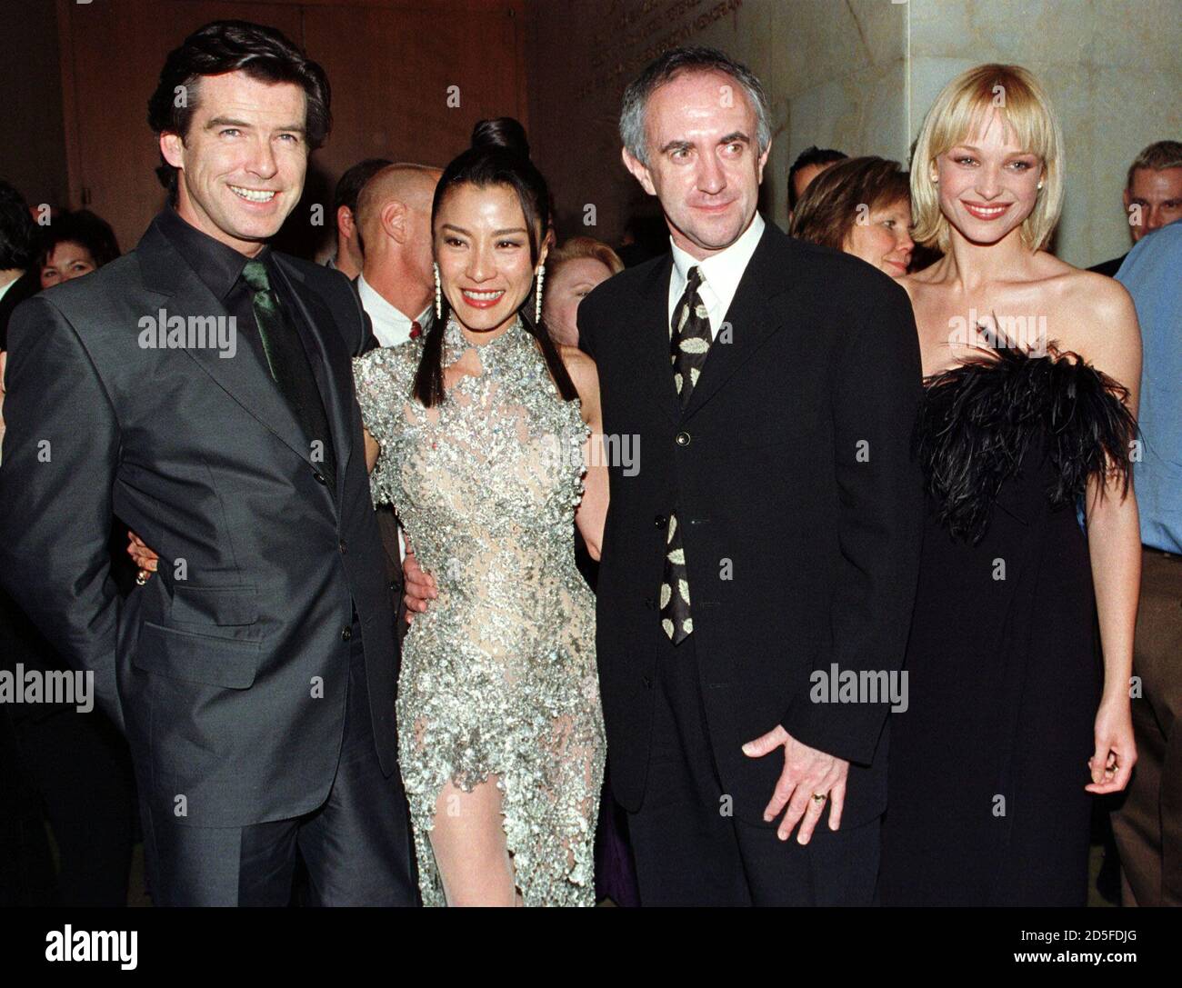 Cast members from the new film "Tomorrow Never Dies" pose together at the  party following the film's Los Angeles premiere December 16 at the Dorothy  Chandler Pavilion. Shown (L-R) are Pierce Brosnan,