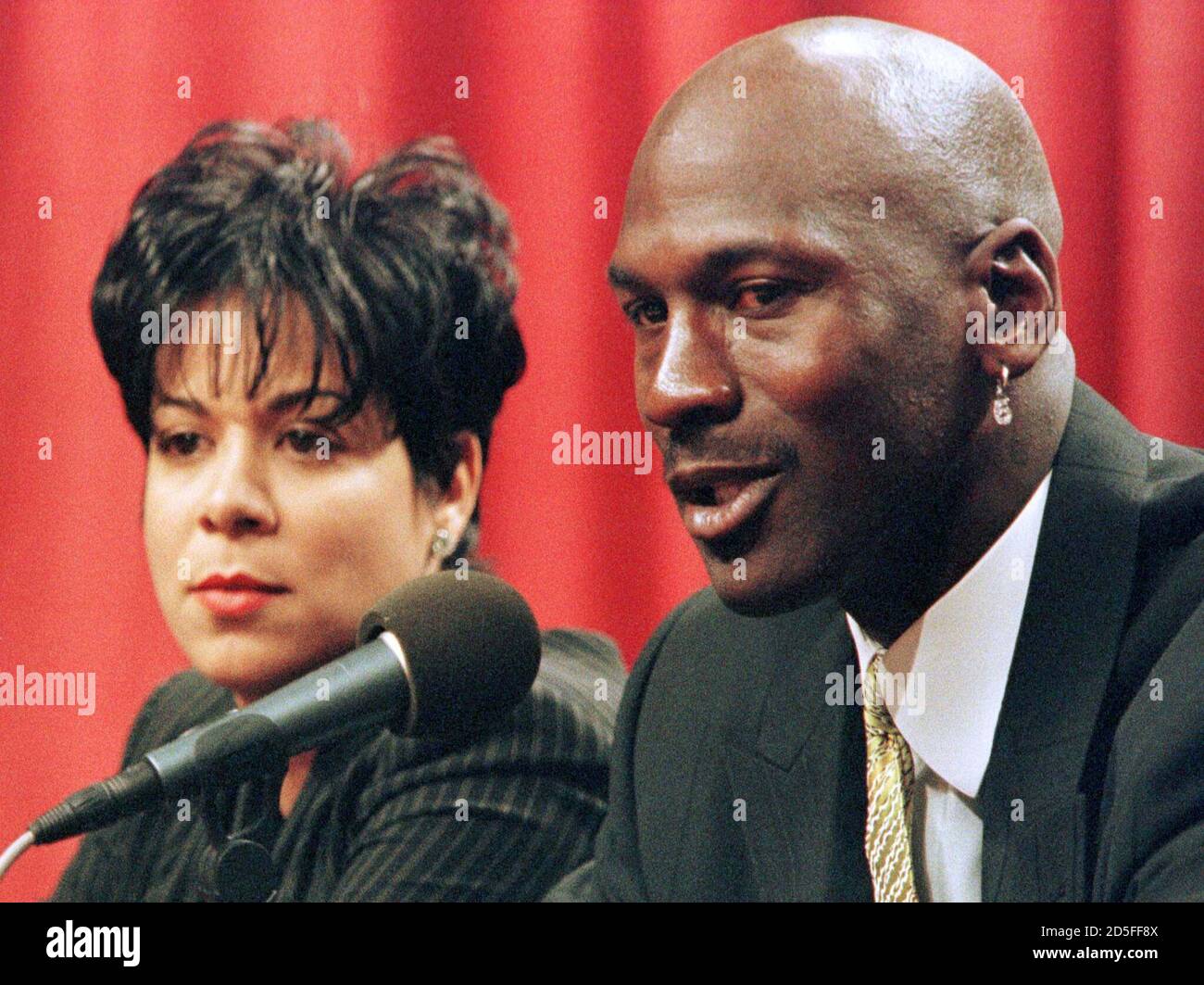 With his wife Juanita at his side, Chicago Bulls' star Michael Jordan, who  led the Bulls to six NBA championships, speaks at a news conference in  Chicago, January 13. Jordan announced that he is retiring from the game of  basketball. SUE/HB/JDP Stock ...