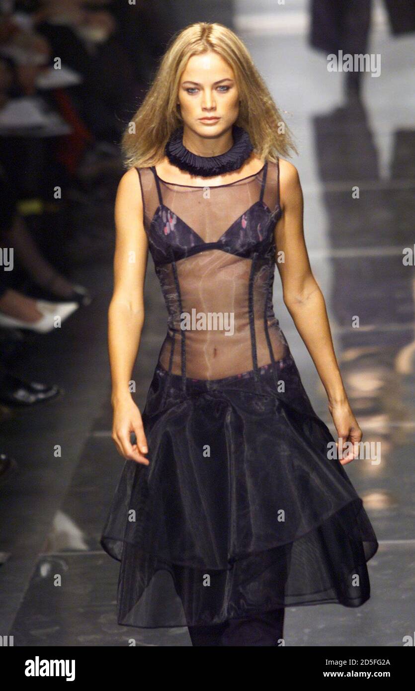 A model wears a tranparent evening dress as part of Versace second line  Versus autumn/winter 1999-2000 collection at Milan's fashion show February  28. The Milan's fashion will end on March 5 with [