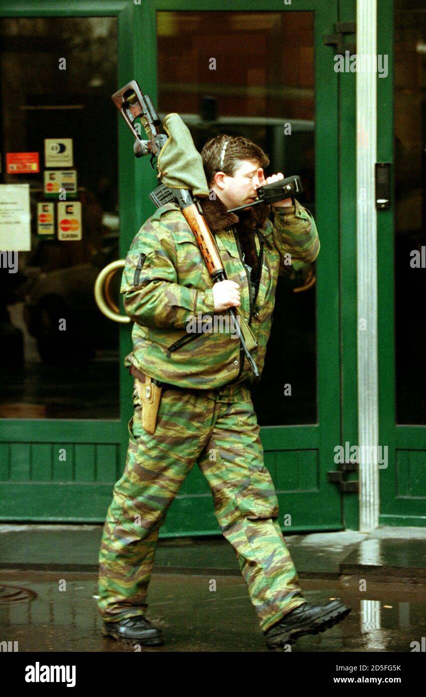 A special police sniper leaves Rossiysky Kredit bank branch ...