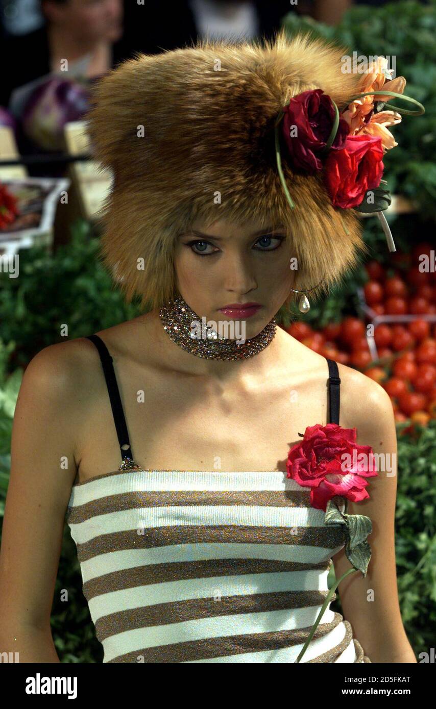 A model displays an outfit with a fur hat as part of the Dolce & Gabbana  Spring/Summer 2000 ready-to-wear collection at Milan fashion show,  September 30. [Milan's fashion will end on October