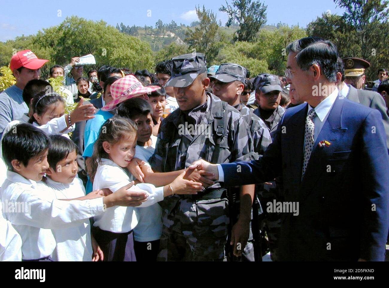 Peruvian President Alberto Fujimori shakes hands with Ecuadorean children  in the border city of Loja, 466 kilometers outside Quito, during a trip in  the Jipiro Park, October 28. Fujimori is ending his