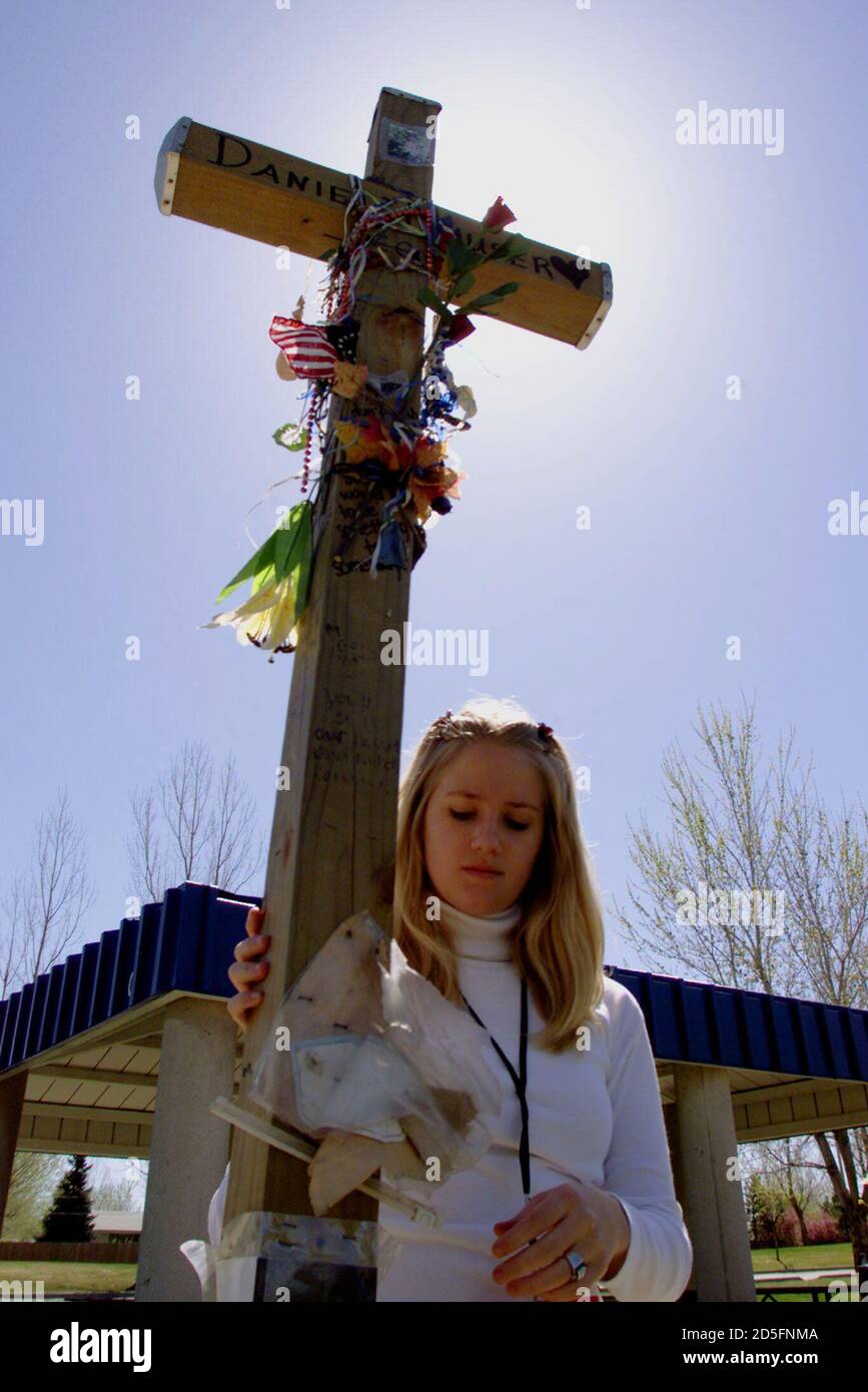 Sunny Boyd Holds The Wooden Cross Erected In Memory Of Daniel Mauser At Columbine High School April Prior To A Memorial Service Marking The One Year Anniversary Of The Worst School Shooting