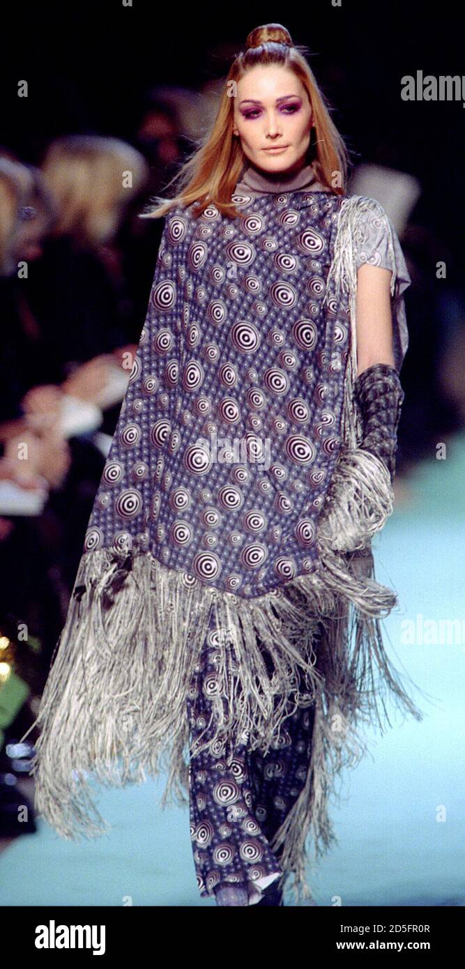 Top Model Carla Bruni Presents This Tunique With Matching Trousers As Part Of French Designer Jean Paul Gaultier S 1996 97 Autumn Winter Ready To Wear Fashion Collection March 15 Stock Photo Alamy