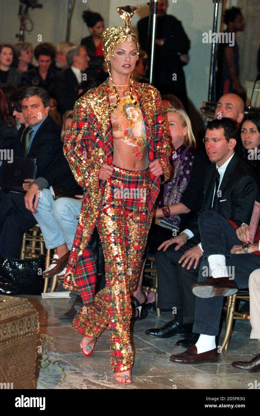 A model for British designer John Galliano presents this tartan pants and  matching jacket with a transparent body stocking with a portrait of Jesus  Christ as part of his 1997/98 Autumn-Winter ready-to-wear