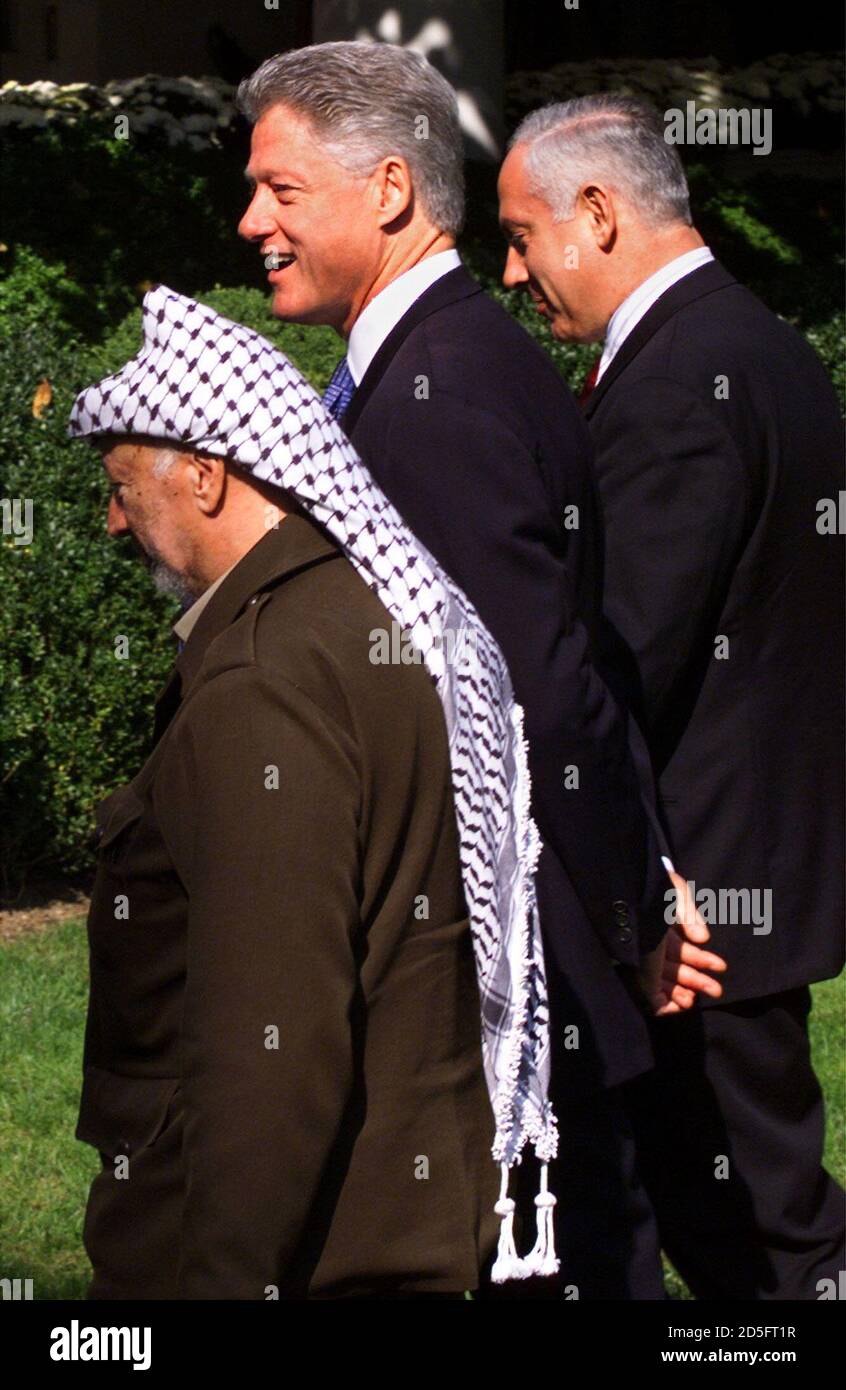 President Clinton Israeli Prime Minister Benjamin Netanyahu R And Palestinian President Yasser Arafat L Leave The Rose Garden Of The White House October 15 After A Statement On The Beginning Of Peace
