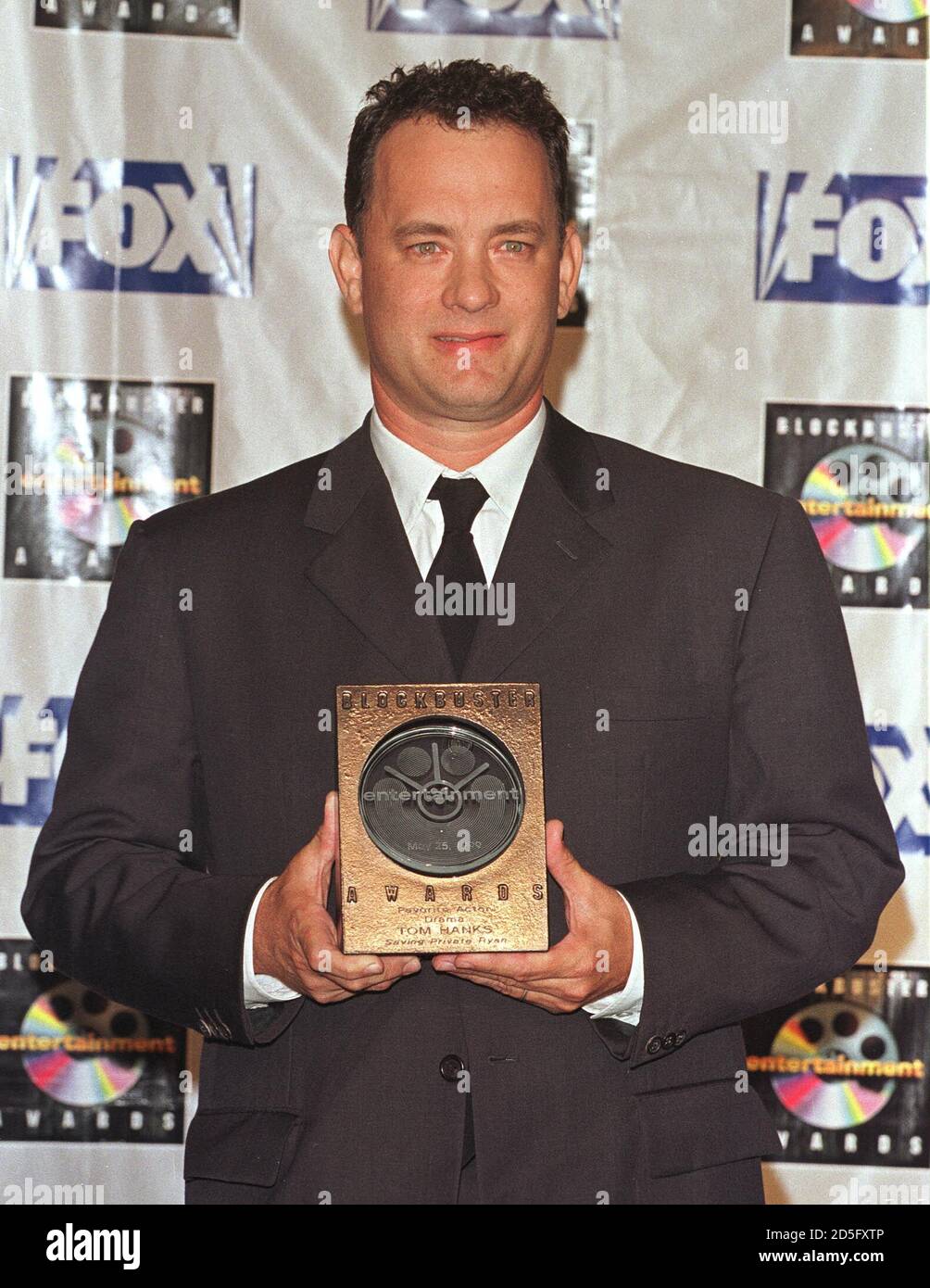 Actor Tom Hanks Poses With The Favorite Drama Actor Award He Won For His Role In The Film Saving Private Ryan At The Taping Of The Fifth Annual Blockbuster Entertainment Awards