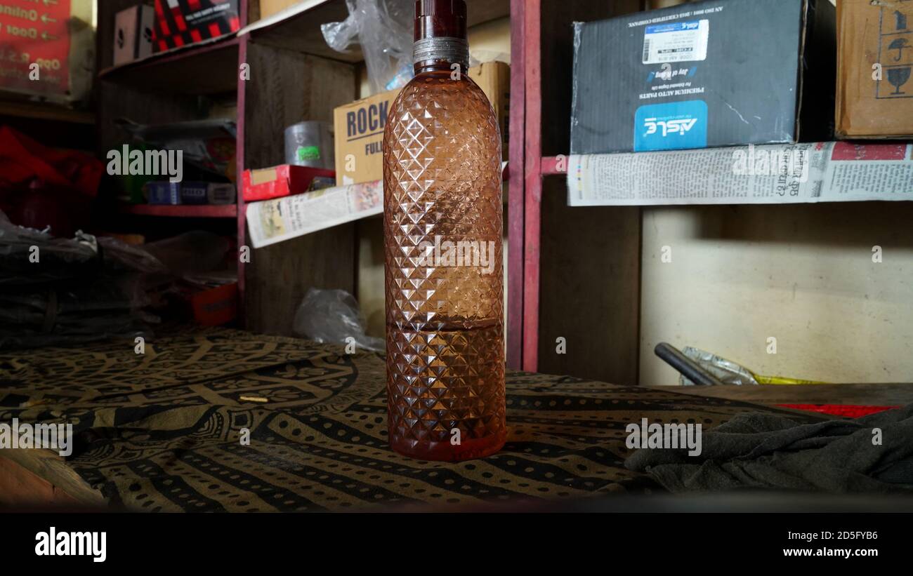 22 September 2020 : Reengus, Jaipur, India / Working from home concept. bottle of water on a wooden desk. Stock Photo