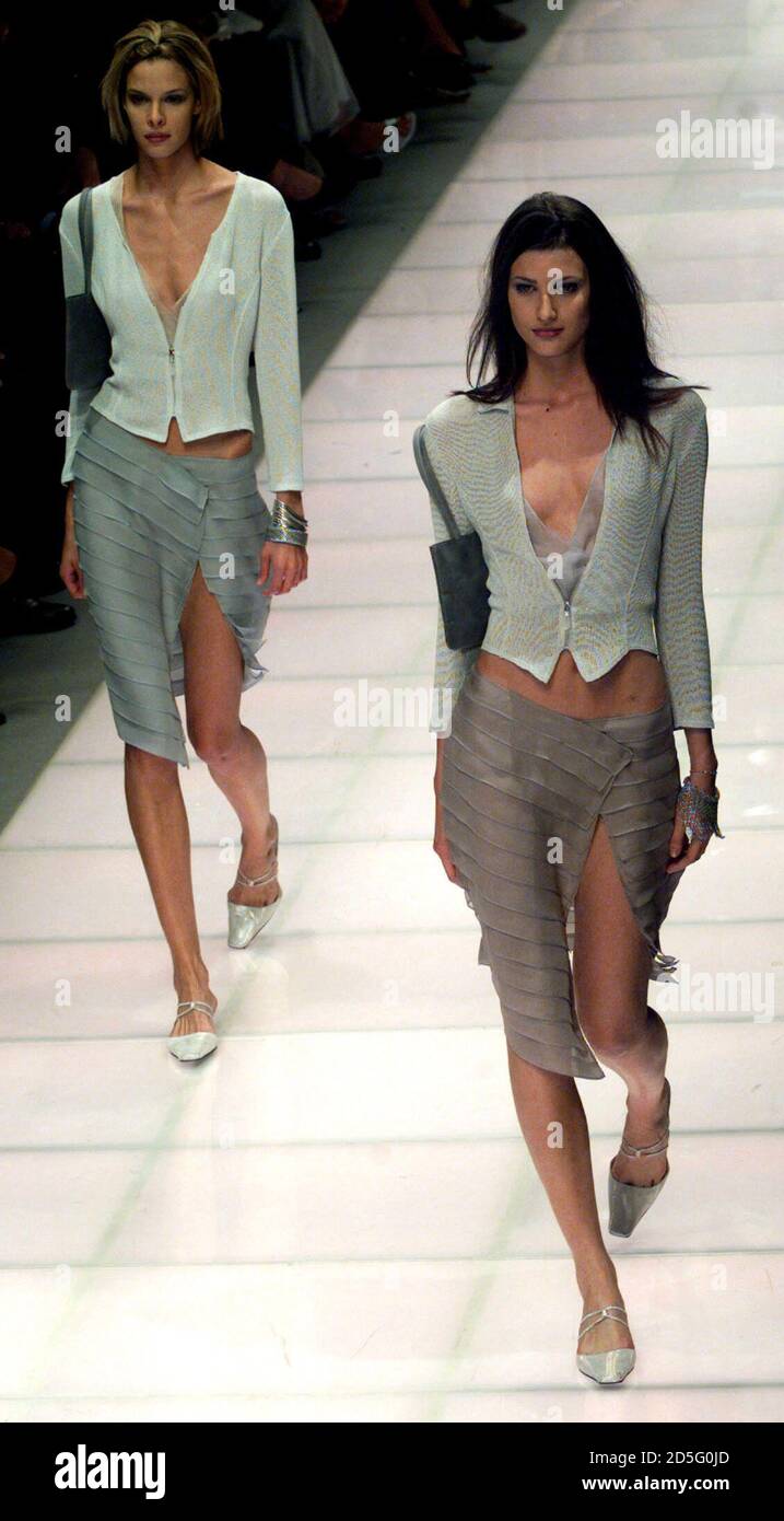 Two models display outfits as part of the Giorgio Armani Spring/Summer 2000  ready-to-wear collection at a Milan fashion show September 29. [Milan's  fashion shows will end on October 1 with Versace's collection. ] ??»