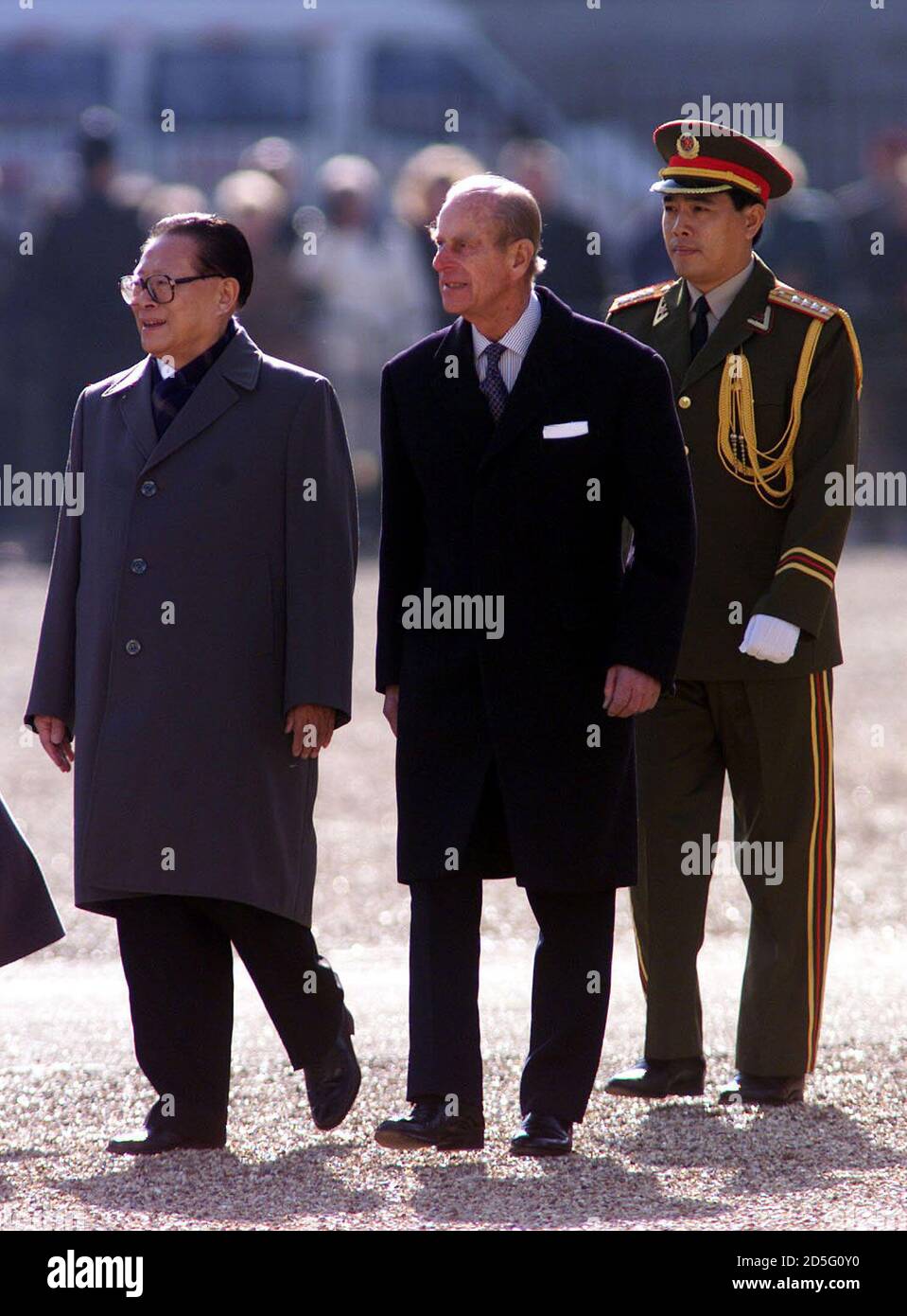China's President Jiang Zemin (L) is escorted by Prince Philip (C) as he inspects a guard of honour at the start of his state visit to Britain, October 19. Protestors including Tibetan independence activists and human rights campaigners have threatened to dog Jiang's visit, the first by a Chinese head of state.  PH/HP Stock Photo